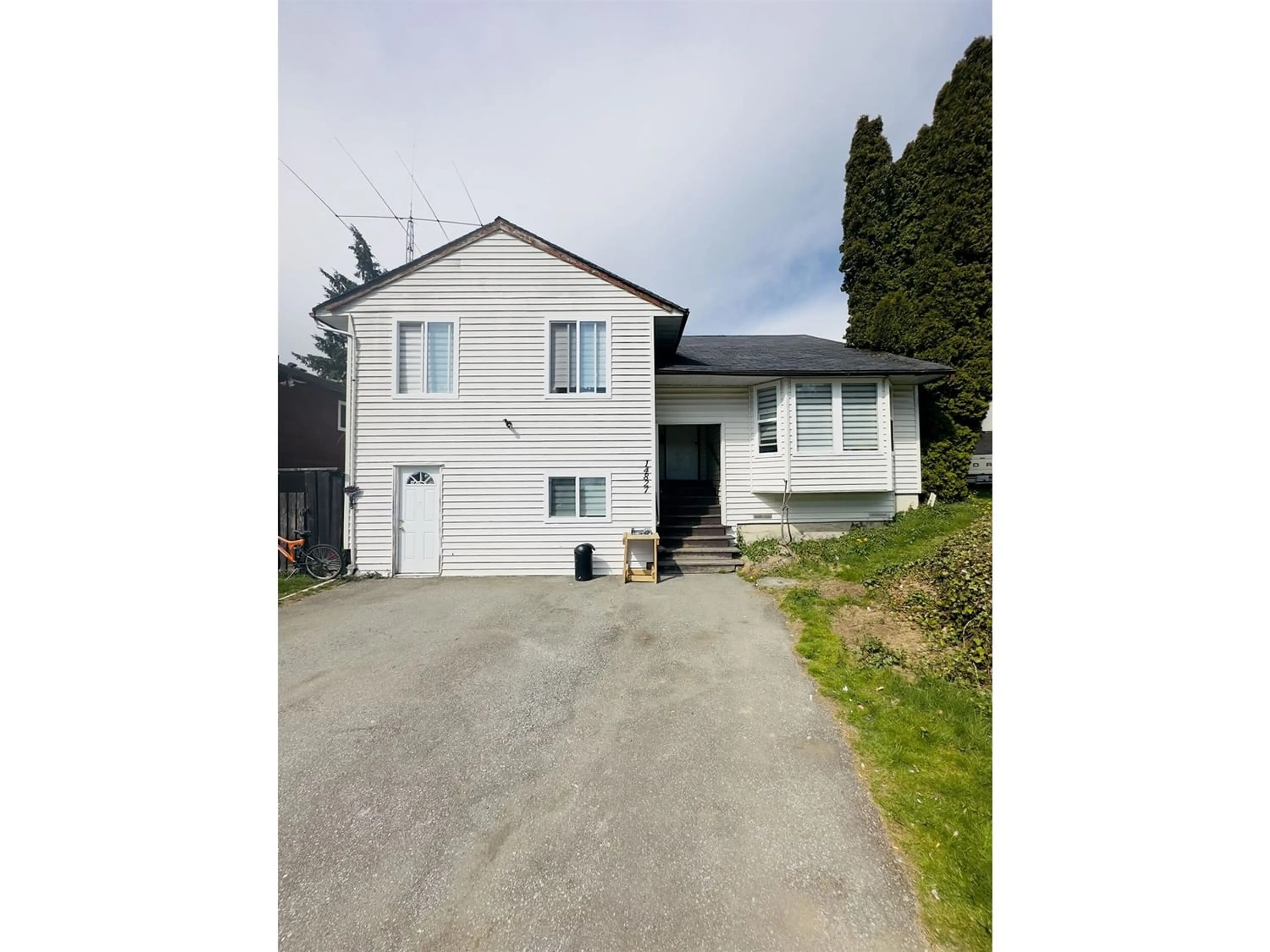Frontside or backside of a home for 14827 88A AVENUE, Surrey British Columbia V3R7T3