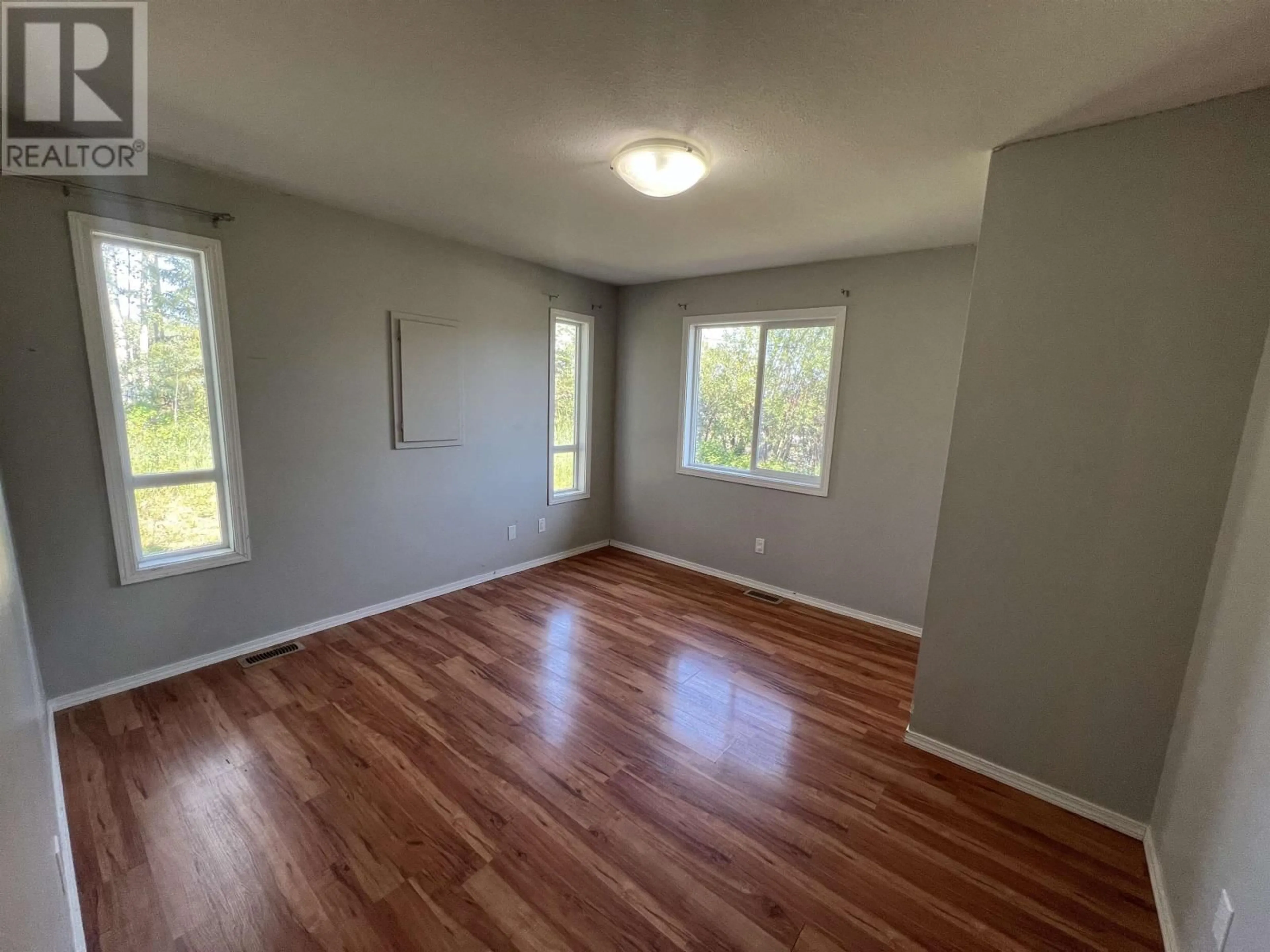 A pic of a room, wood floors for 5203 52 STREET, Fort Nelson British Columbia V0C1R0