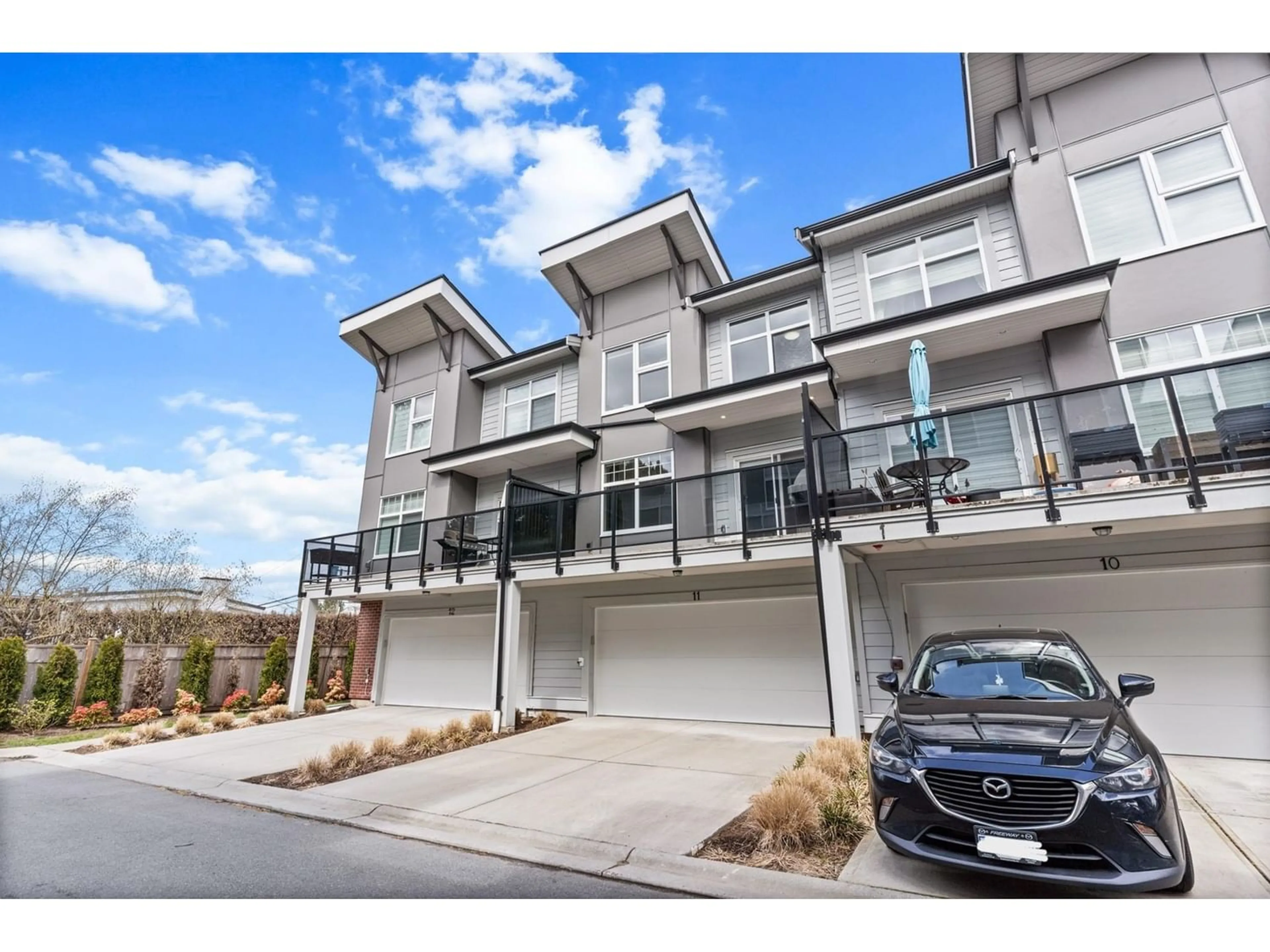 A pic from exterior of the house or condo for 11 22334 48 AVENUE, Langley British Columbia V3A3N5