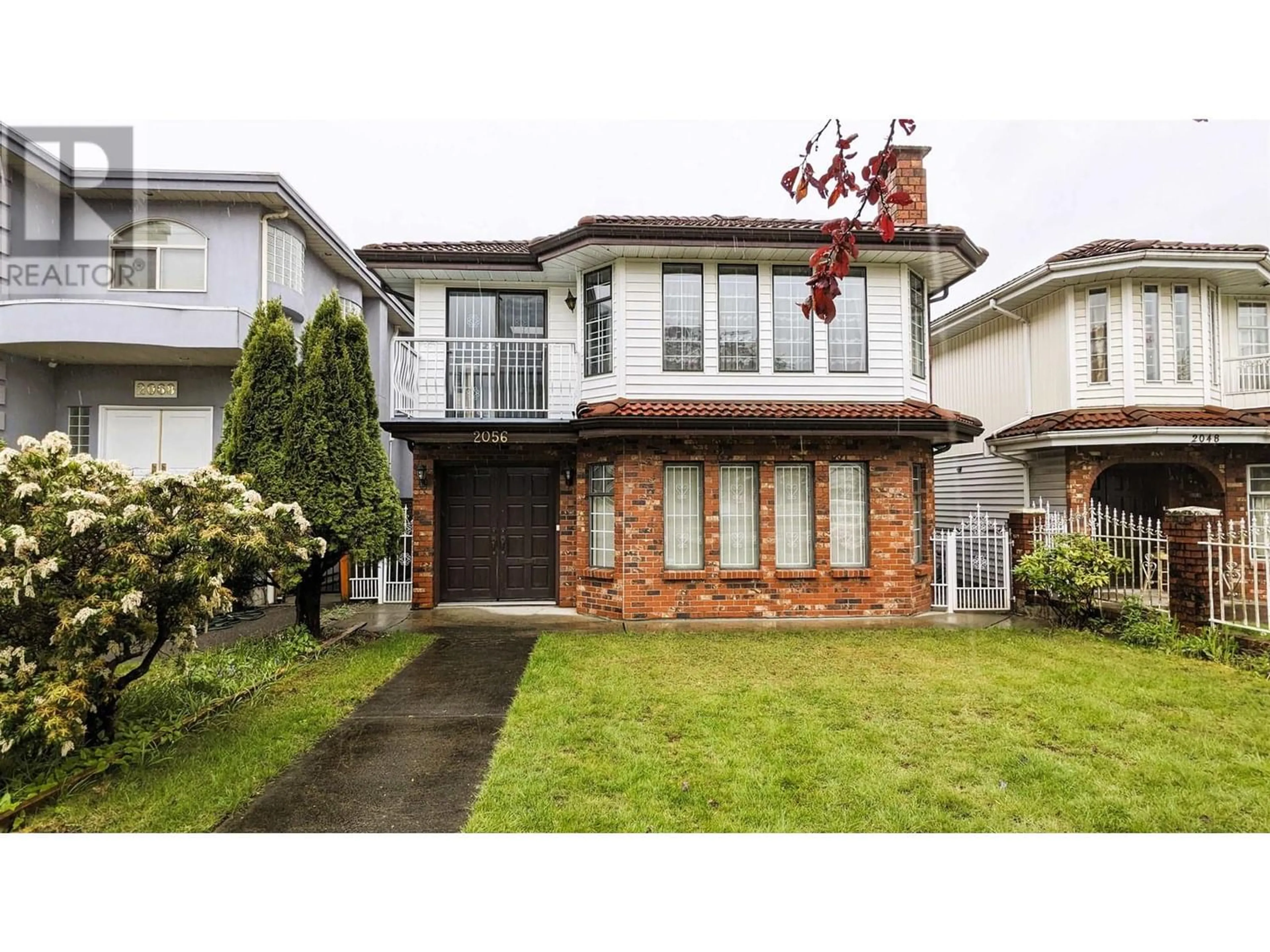 Frontside or backside of a home for 2056 E 52ND AVENUE, Vancouver British Columbia V5P1W9