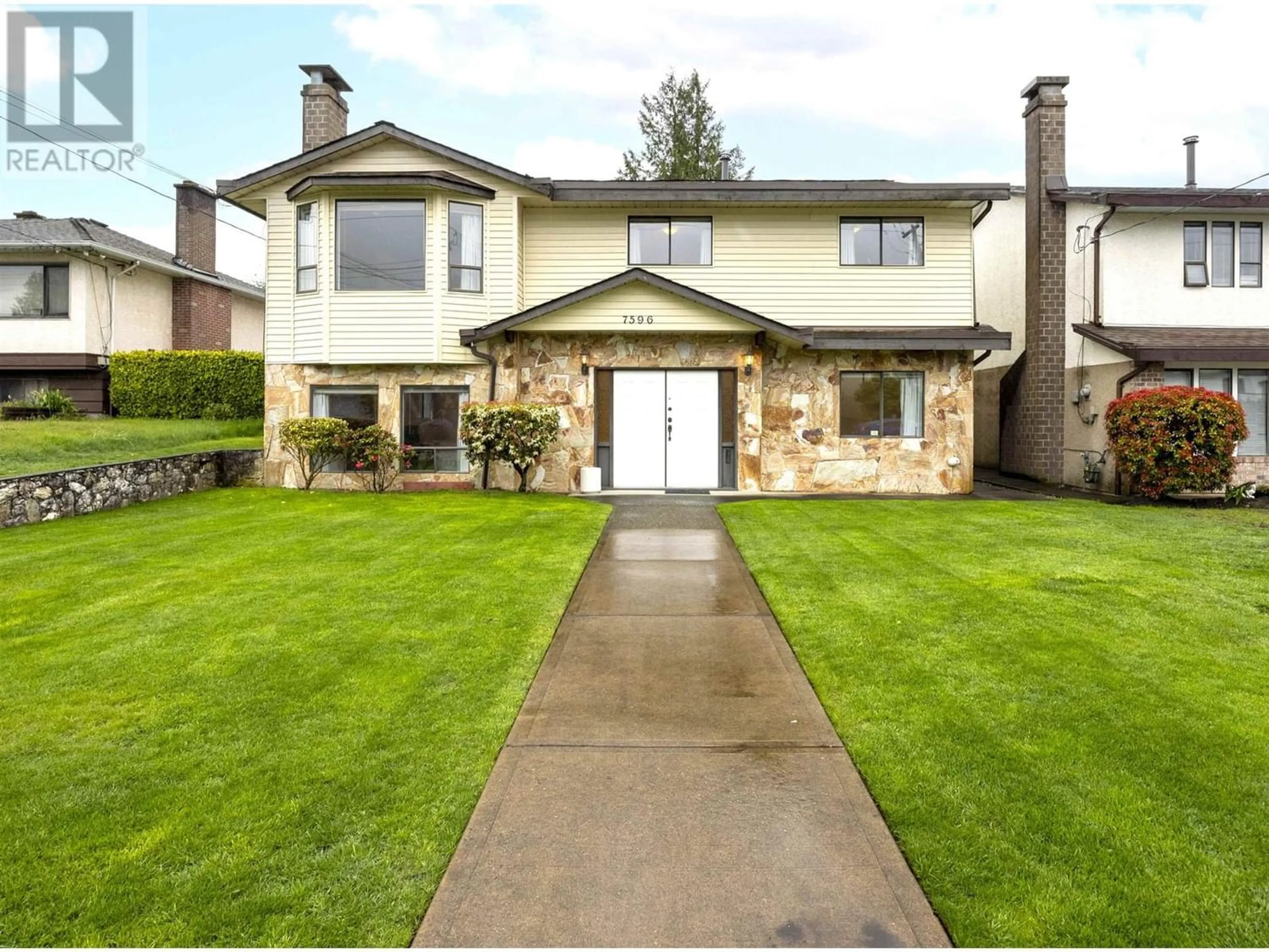 Frontside or backside of a home for 7596 ELWELL STREET, Burnaby British Columbia V5E1L6