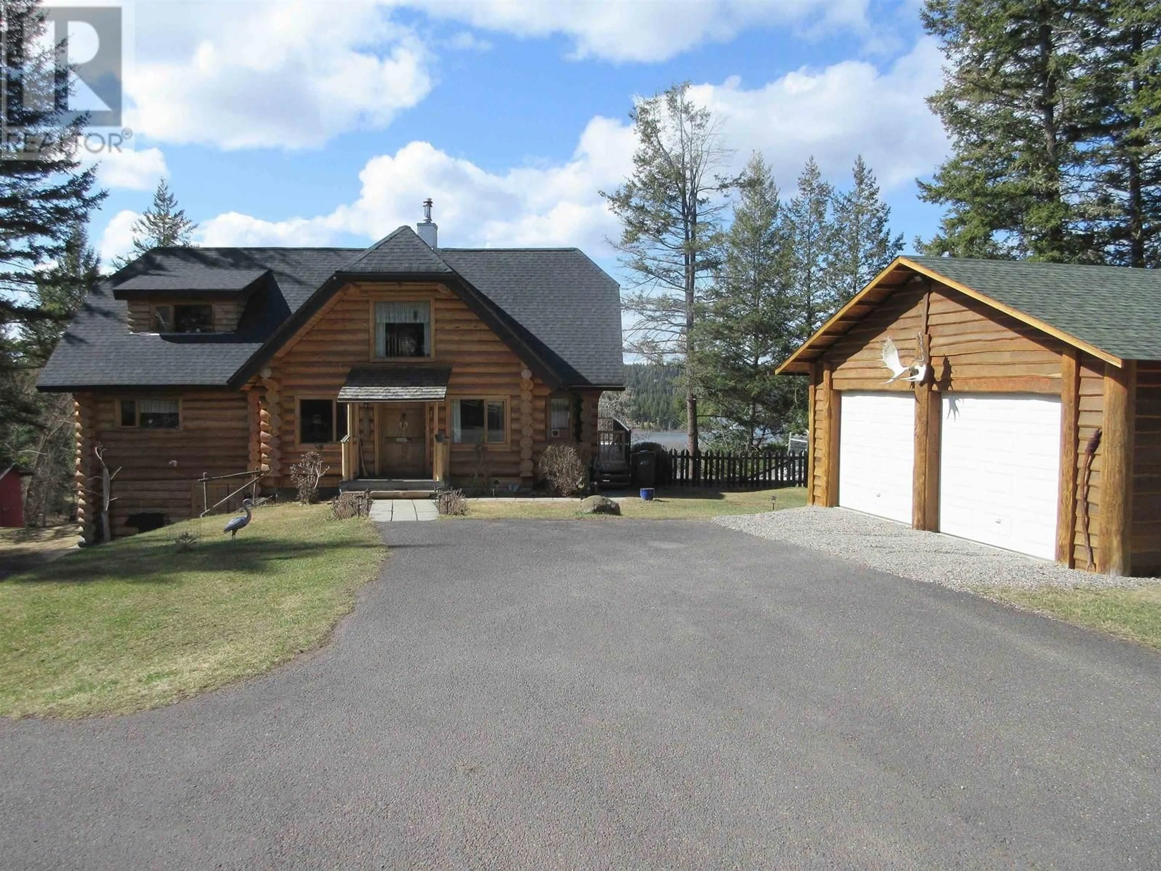 A pic from outside/outdoor area/front of a property/back of a property/a pic from drone, mountain view for 4768 TELQUA DRIVE, 108 Mile Ranch British Columbia V0K2Z0