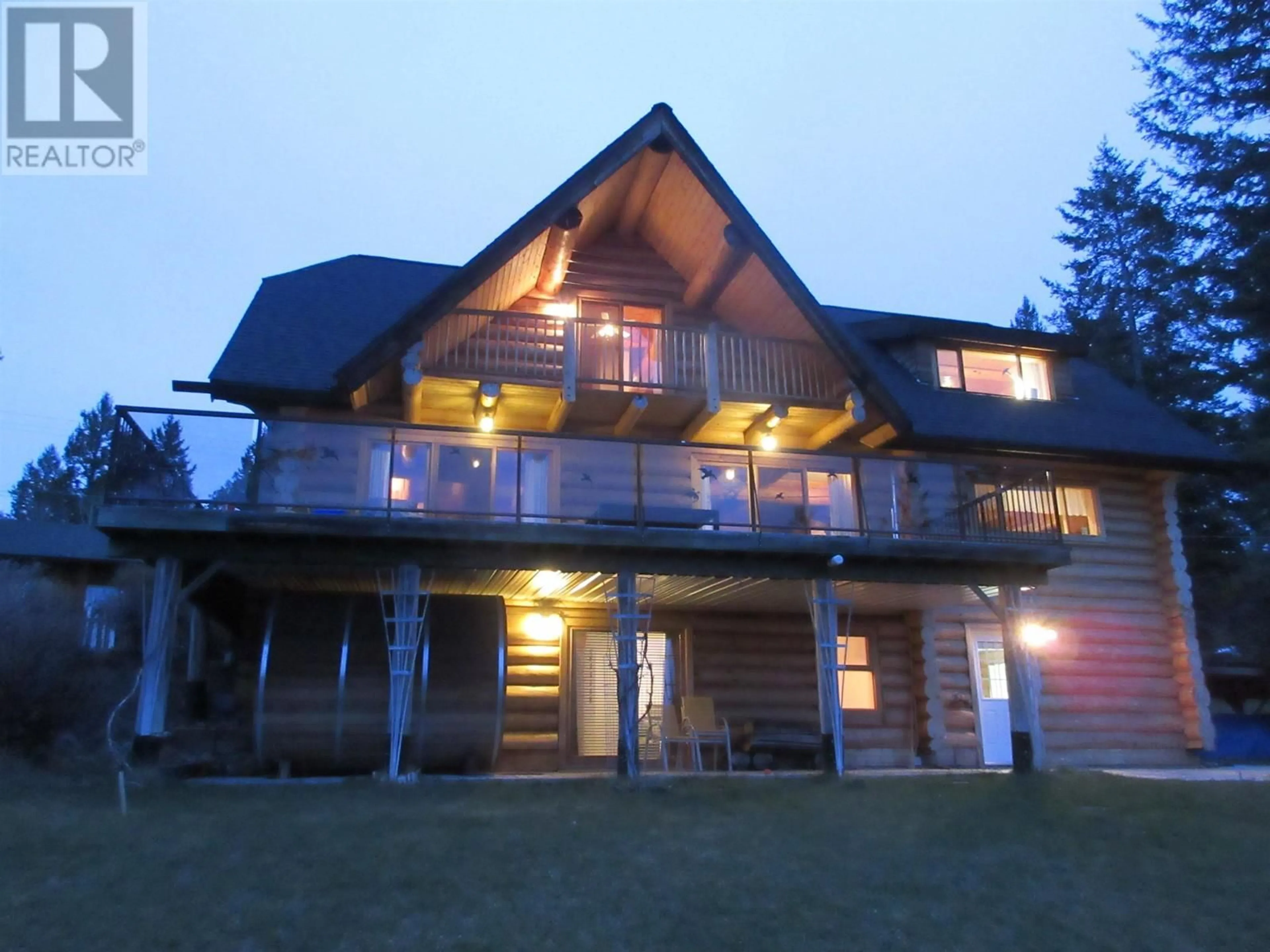A pic from outside/outdoor area/front of a property/back of a property/a pic from drone, water/lake/river/ocean view for 4768 TELQUA DRIVE, 108 Mile Ranch British Columbia V0K2Z0