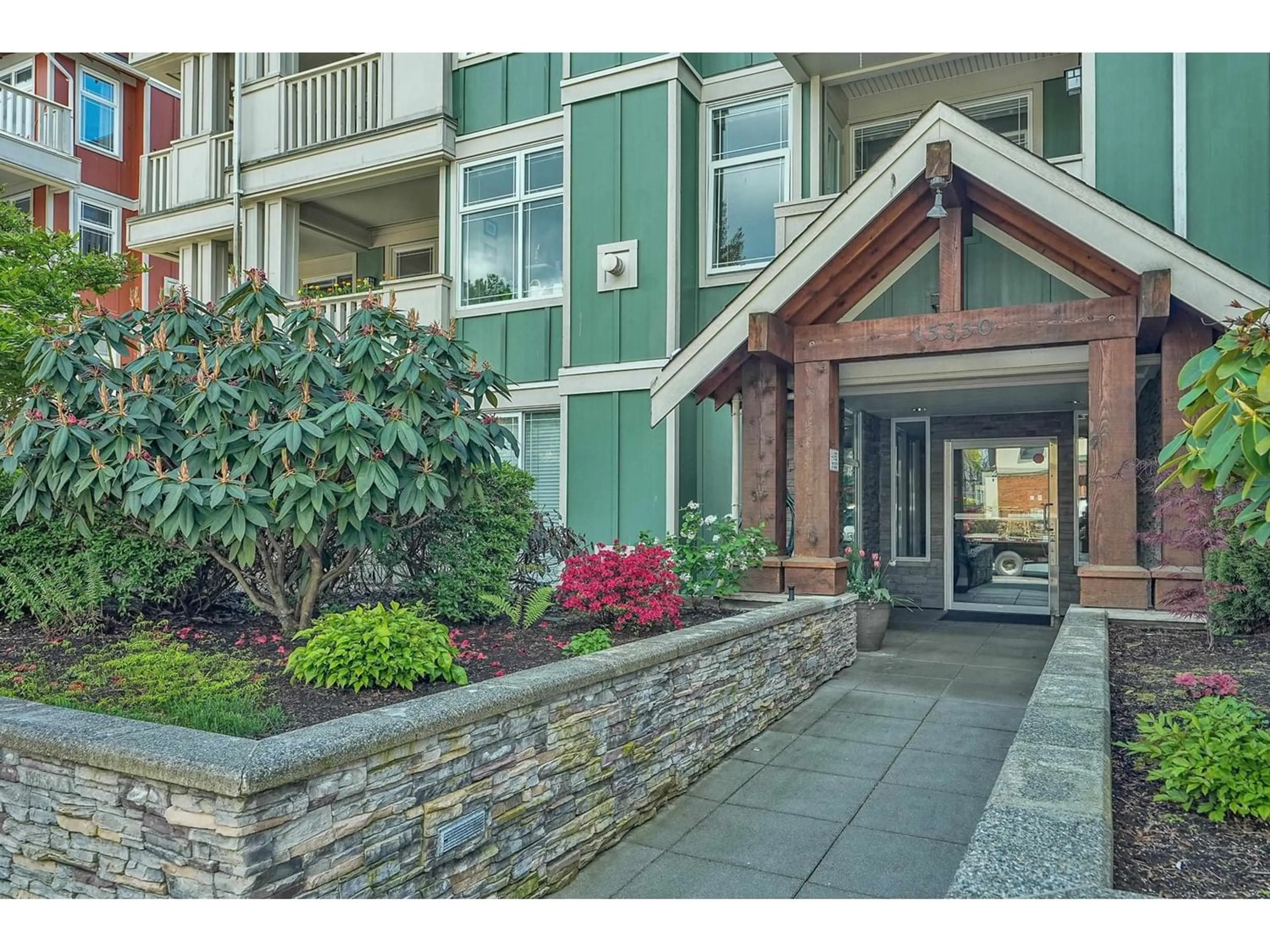 A pic from exterior of the house or condo for 211 15350 16A AVENUE, Surrey British Columbia V4A1S9