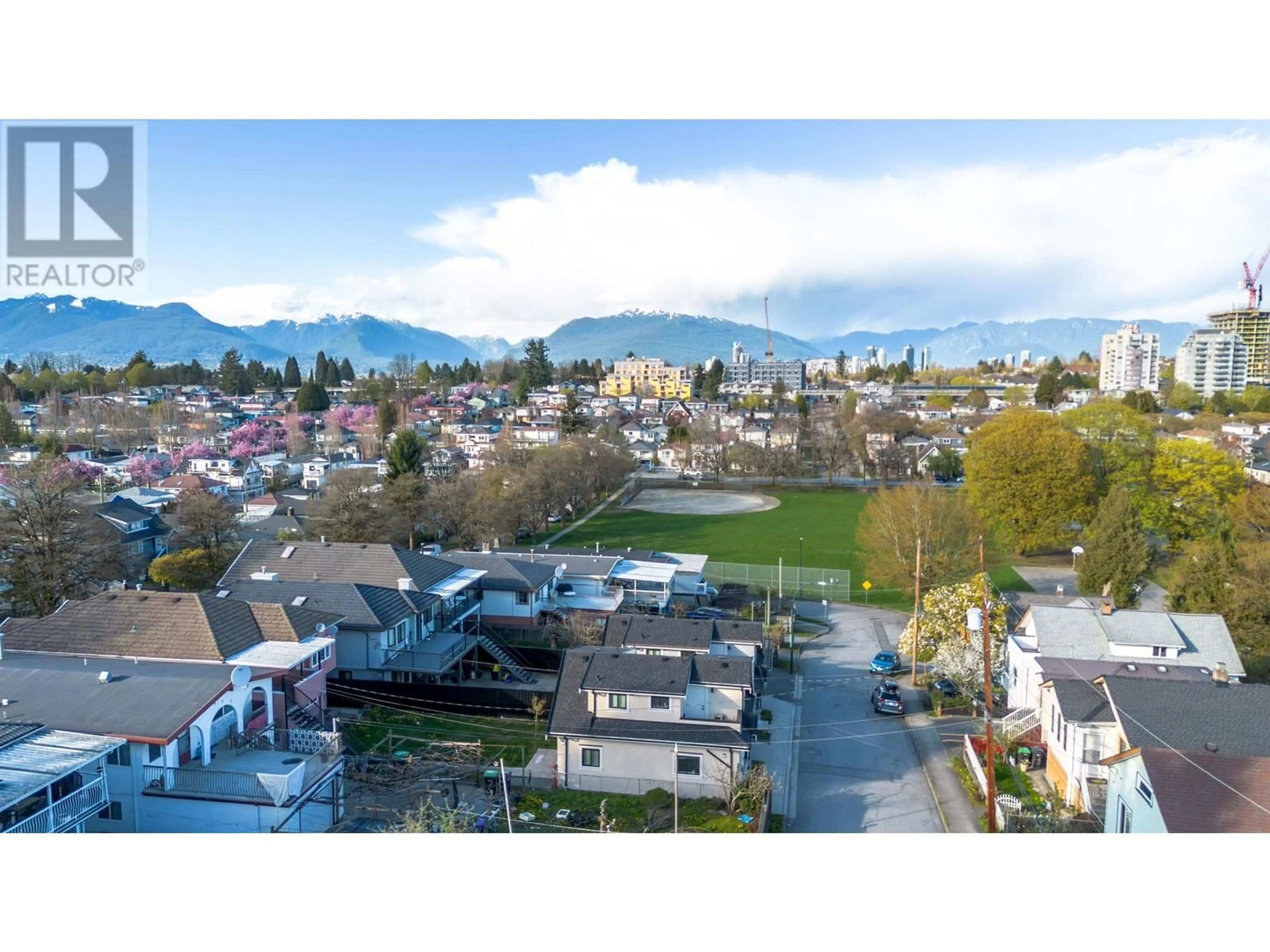 A pic from outside/outdoor area/front of a property/back of a property/a pic from drone, mountain view for 5311 MCKINNON STREET, Vancouver British Columbia V5R4C7