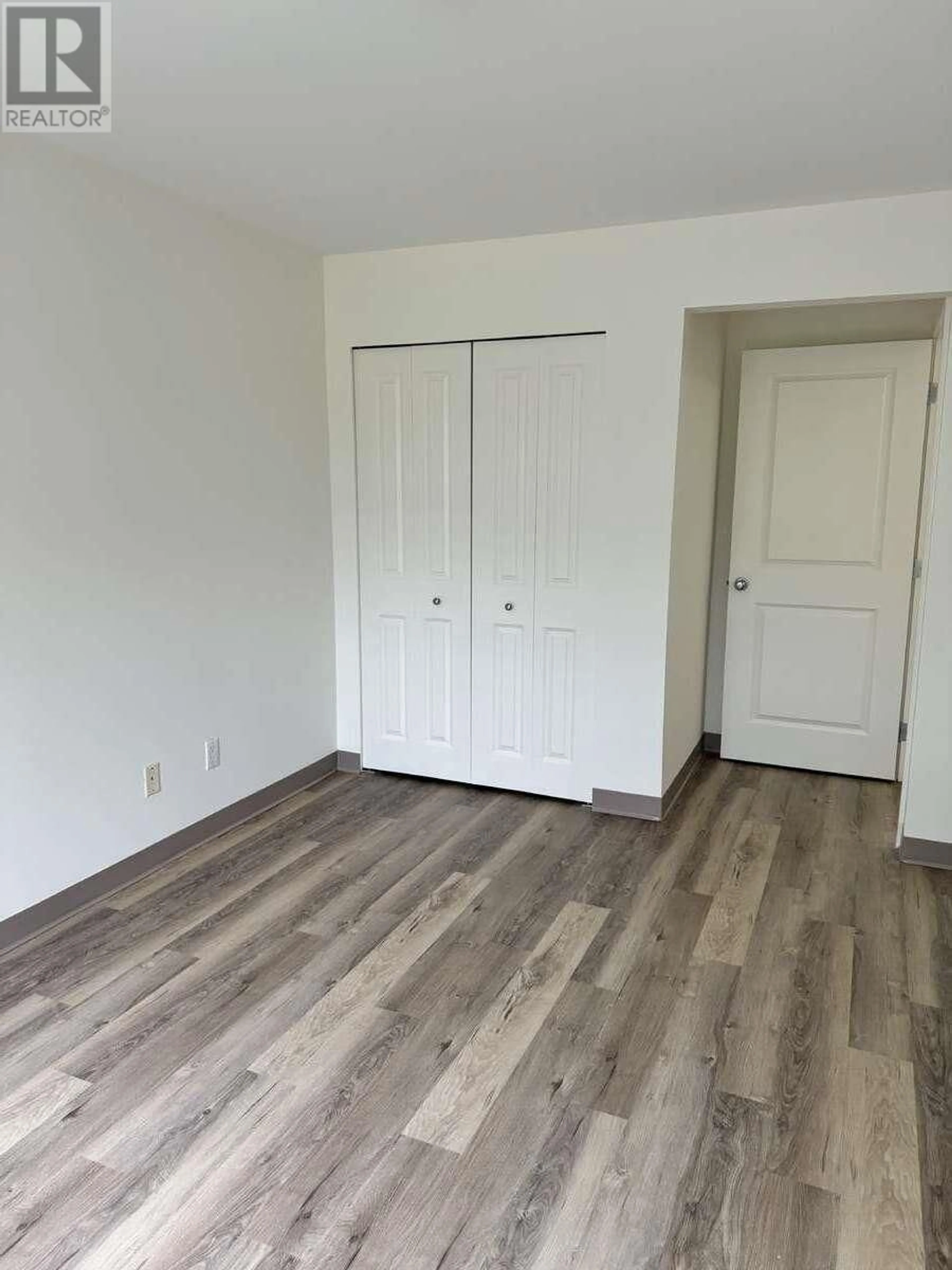 A pic of a room, wood floors for 207 5631 INLET AVENUE, Sechelt British Columbia V7Z0J1