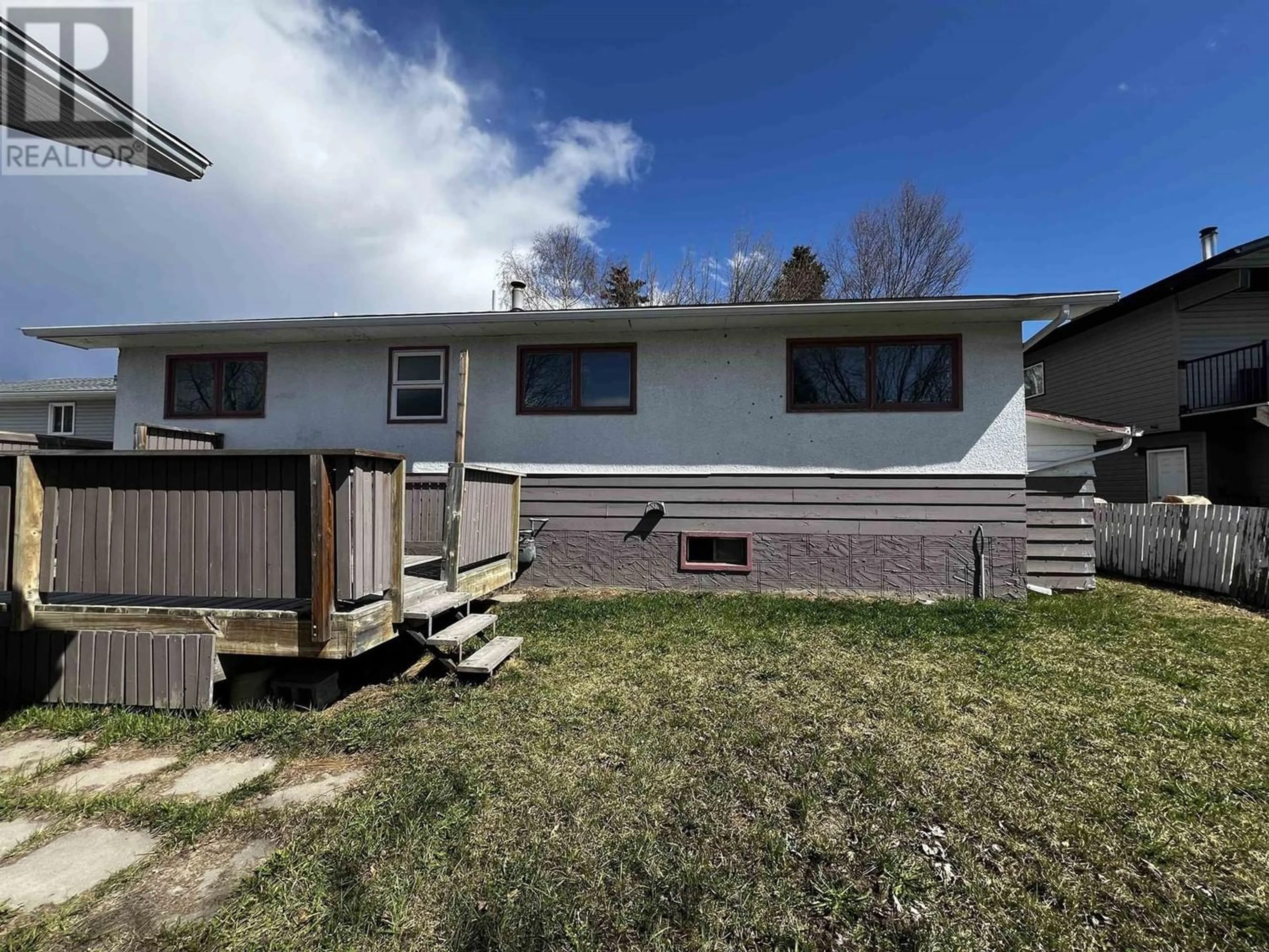 Frontside or backside of a home, the fenced backyard for 725 2ND WEST AVENUE, Fort St. James British Columbia V0J1P0