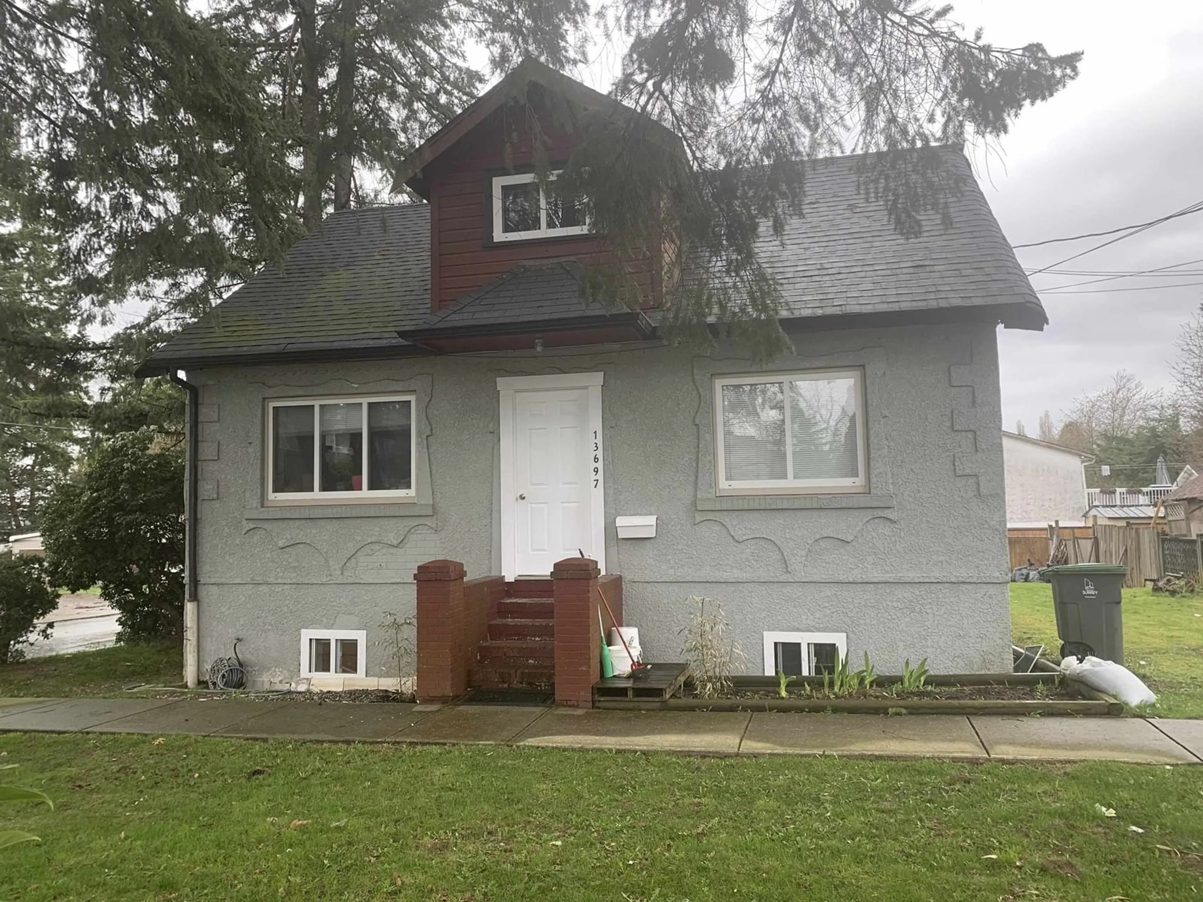 Home with vinyl exterior material, street for 13697 GROSVENOR, Surrey British Columbia V3R5E3