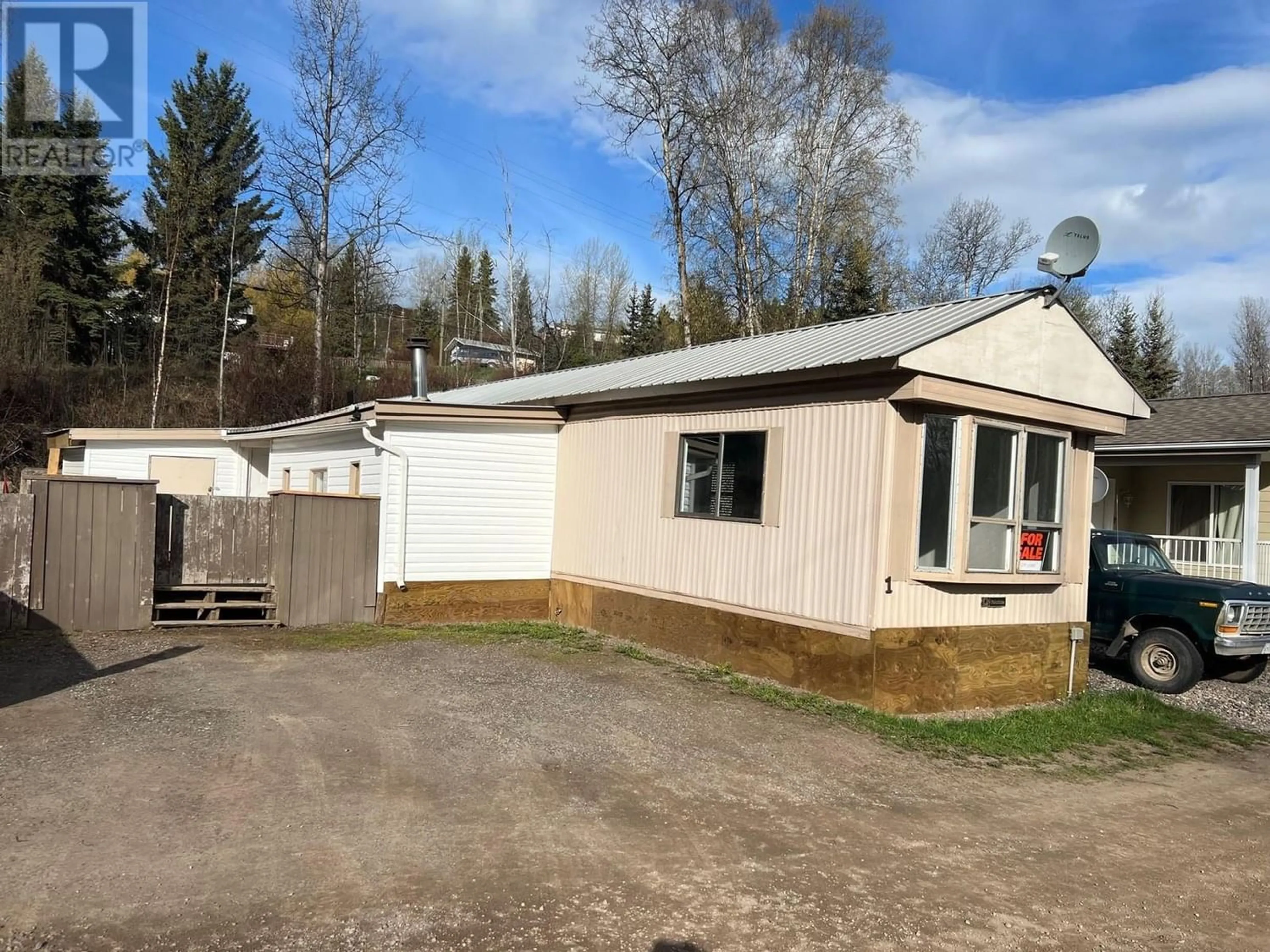 Frontside or backside of a home for 1 2123 RIVERSIDE DRIVE, Smithers British Columbia V0J2N0
