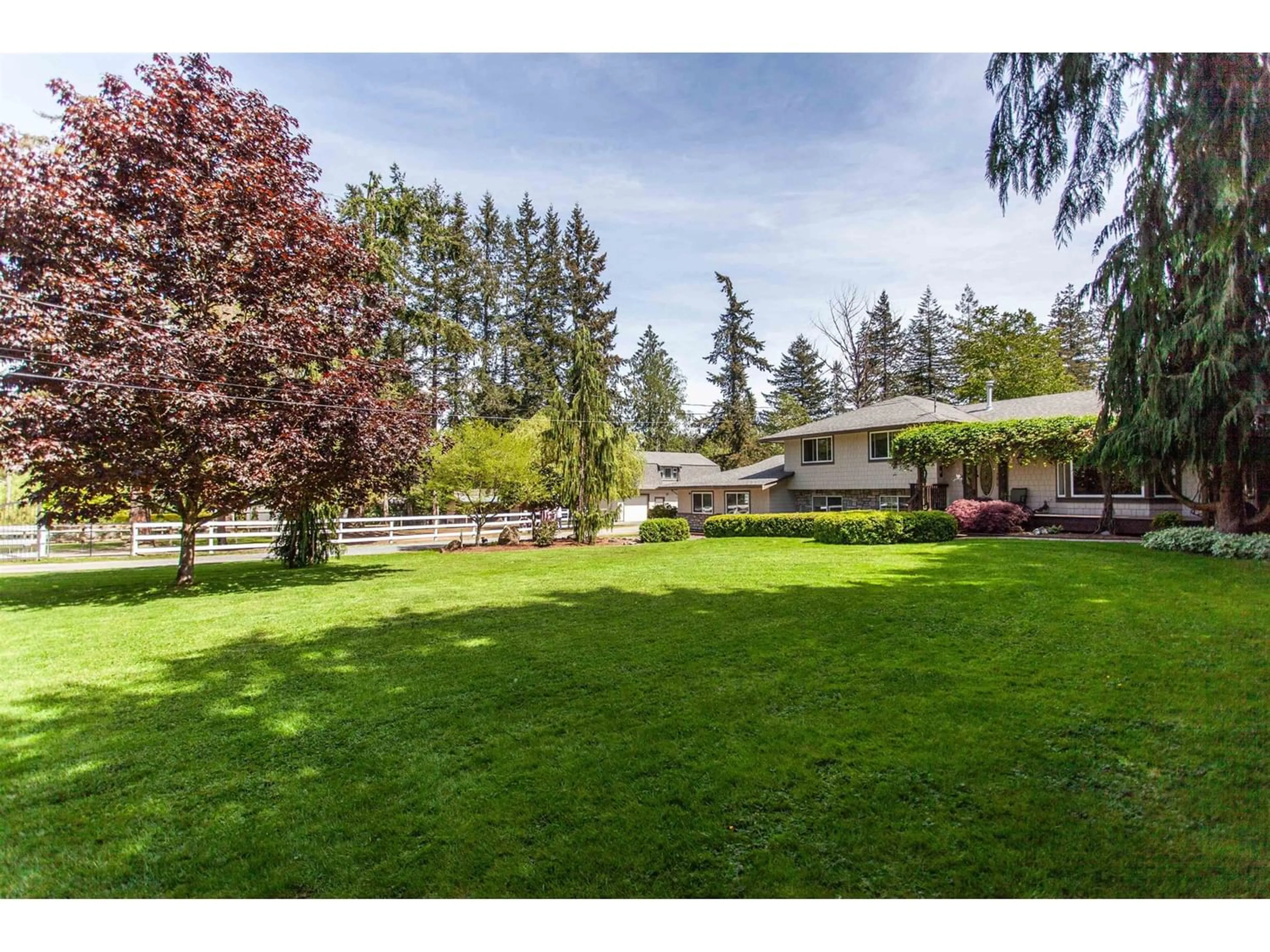 A pic from exterior of the house or condo, the fenced backyard for 20058 FERNRIDGE CRESCENT, Langley British Columbia V2Z1X5