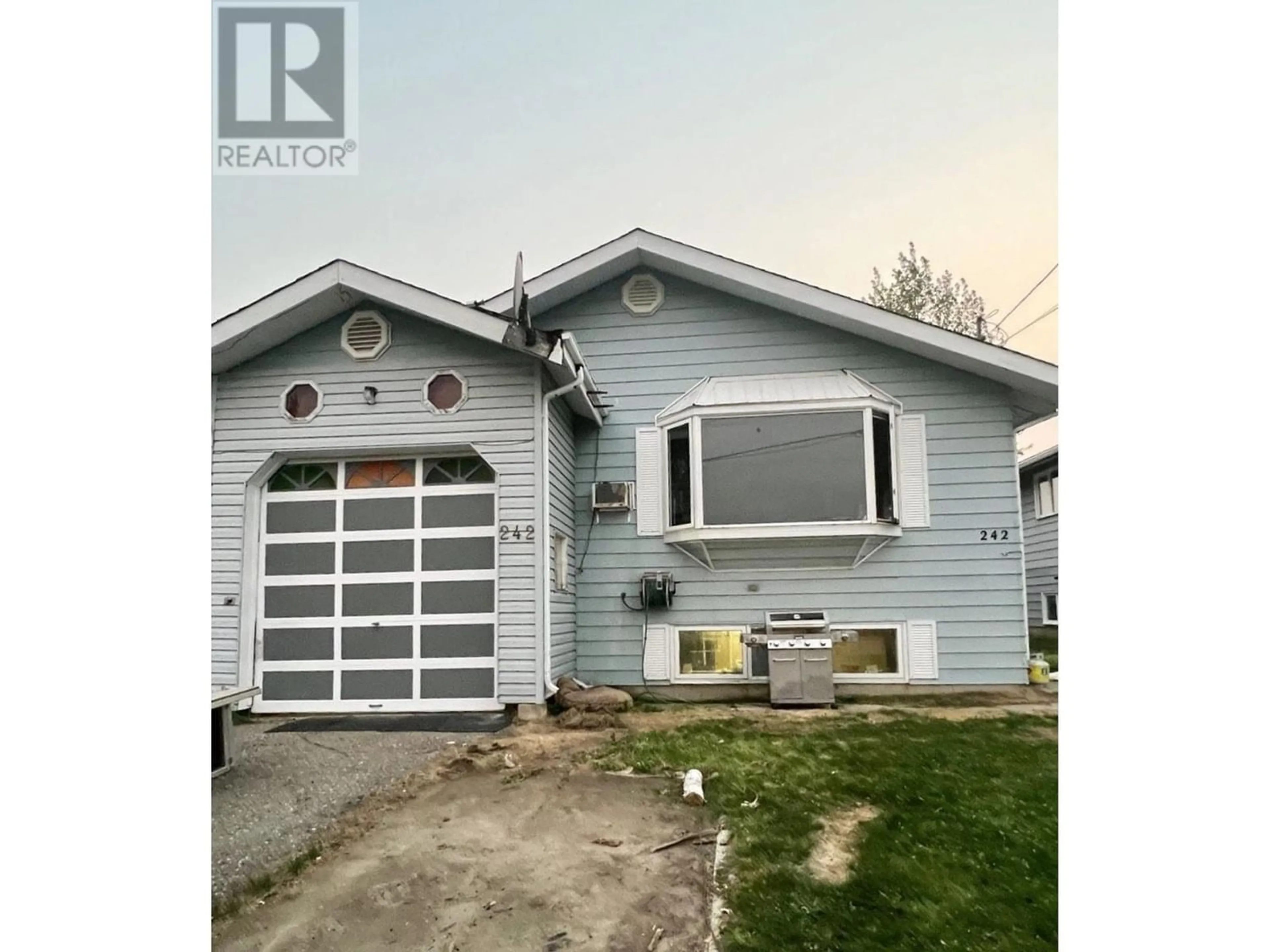 Frontside or backside of a home for 242 BLACKWATER CRESCENT, Mackenzie British Columbia V0J2C0