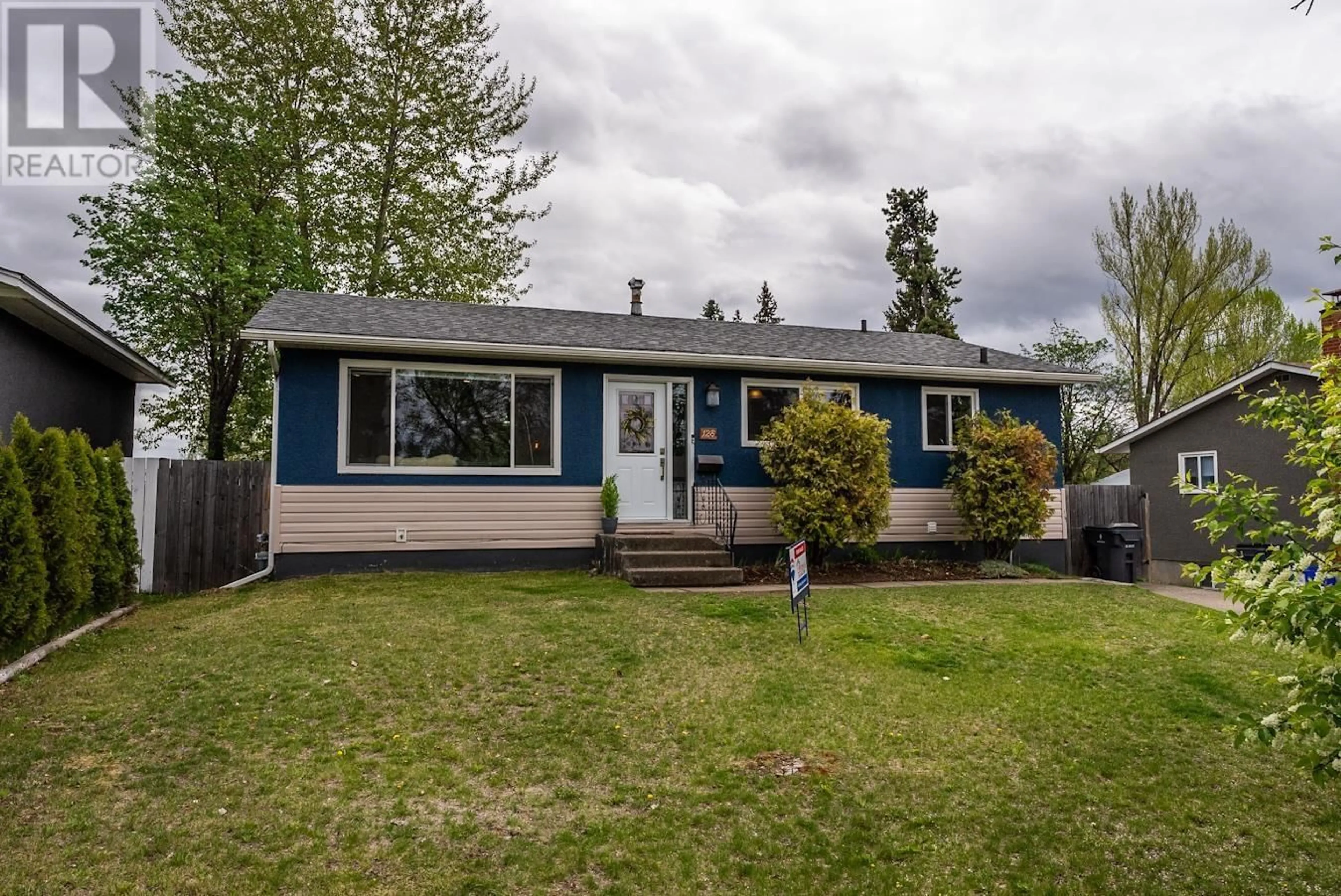 Frontside or backside of a home for 128 MCQUEEN CRESCENT, Prince George British Columbia V2M4R8