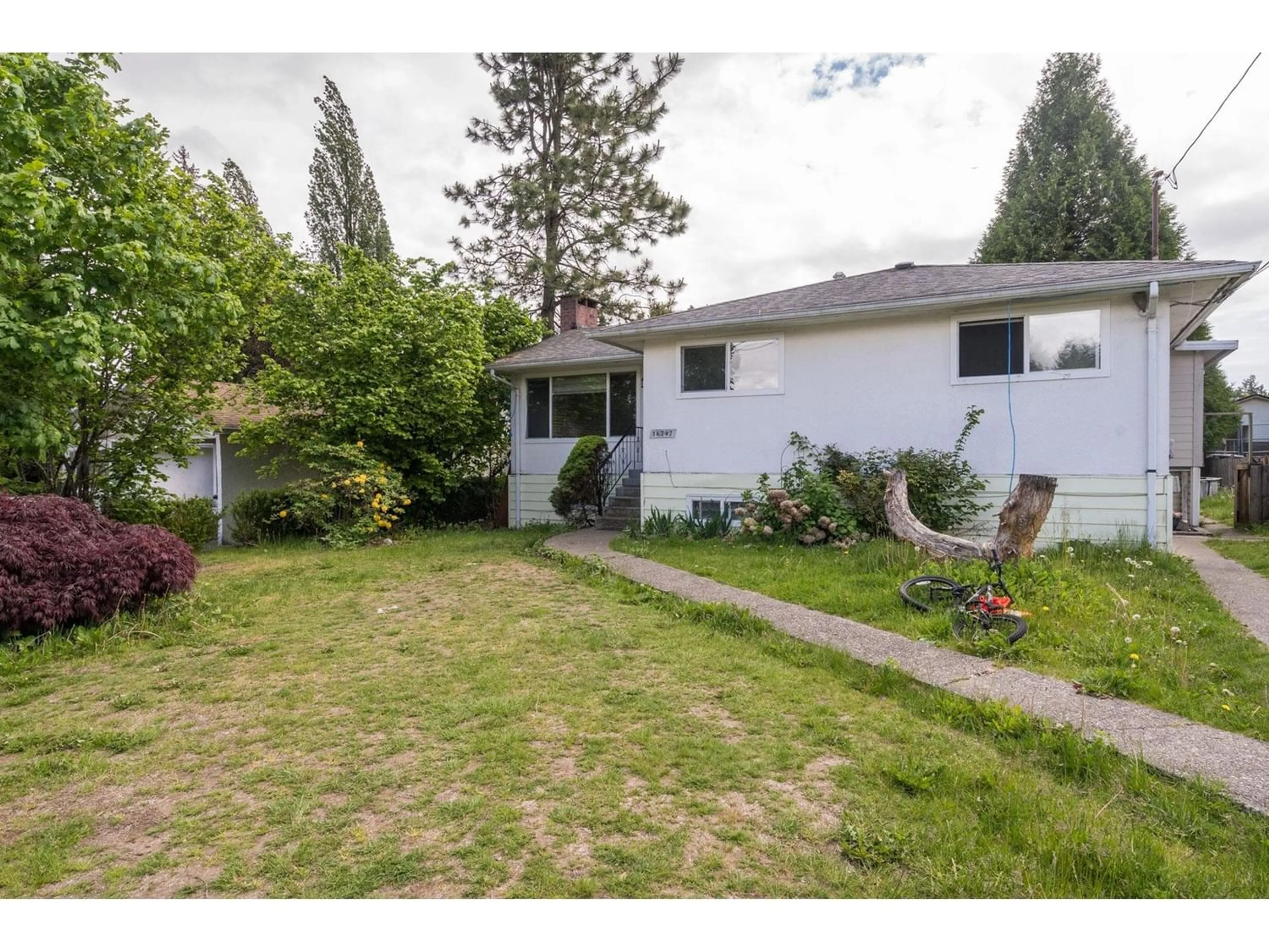 Frontside or backside of a home for 14742 106A AVENUE, Surrey British Columbia V3R1T6