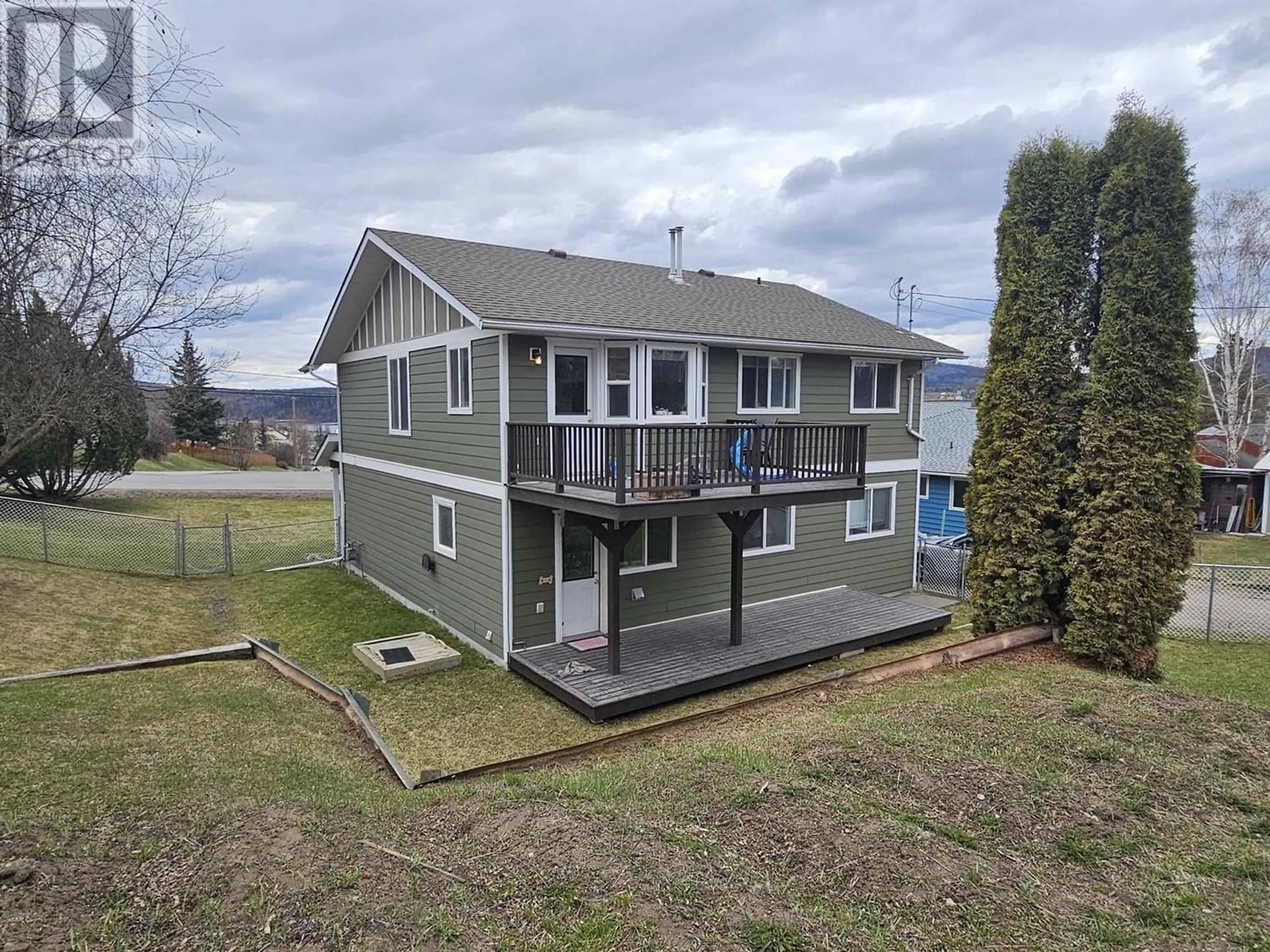 Frontside or backside of a home, the fenced backyard for 67 8TH AVENUE, Burns Lake British Columbia V0J1E0