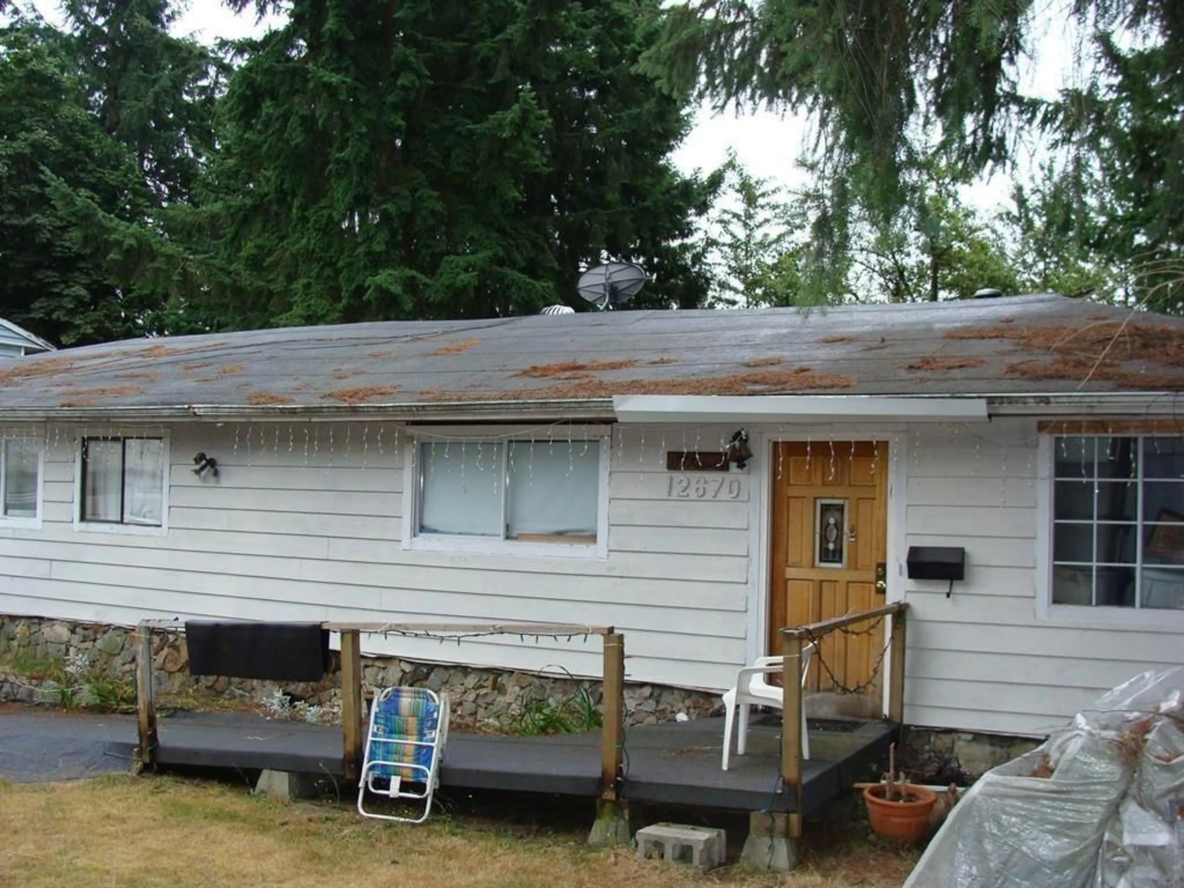 Frontside or backside of a home for 12670 94 AVENUE, Surrey British Columbia V3V1L9