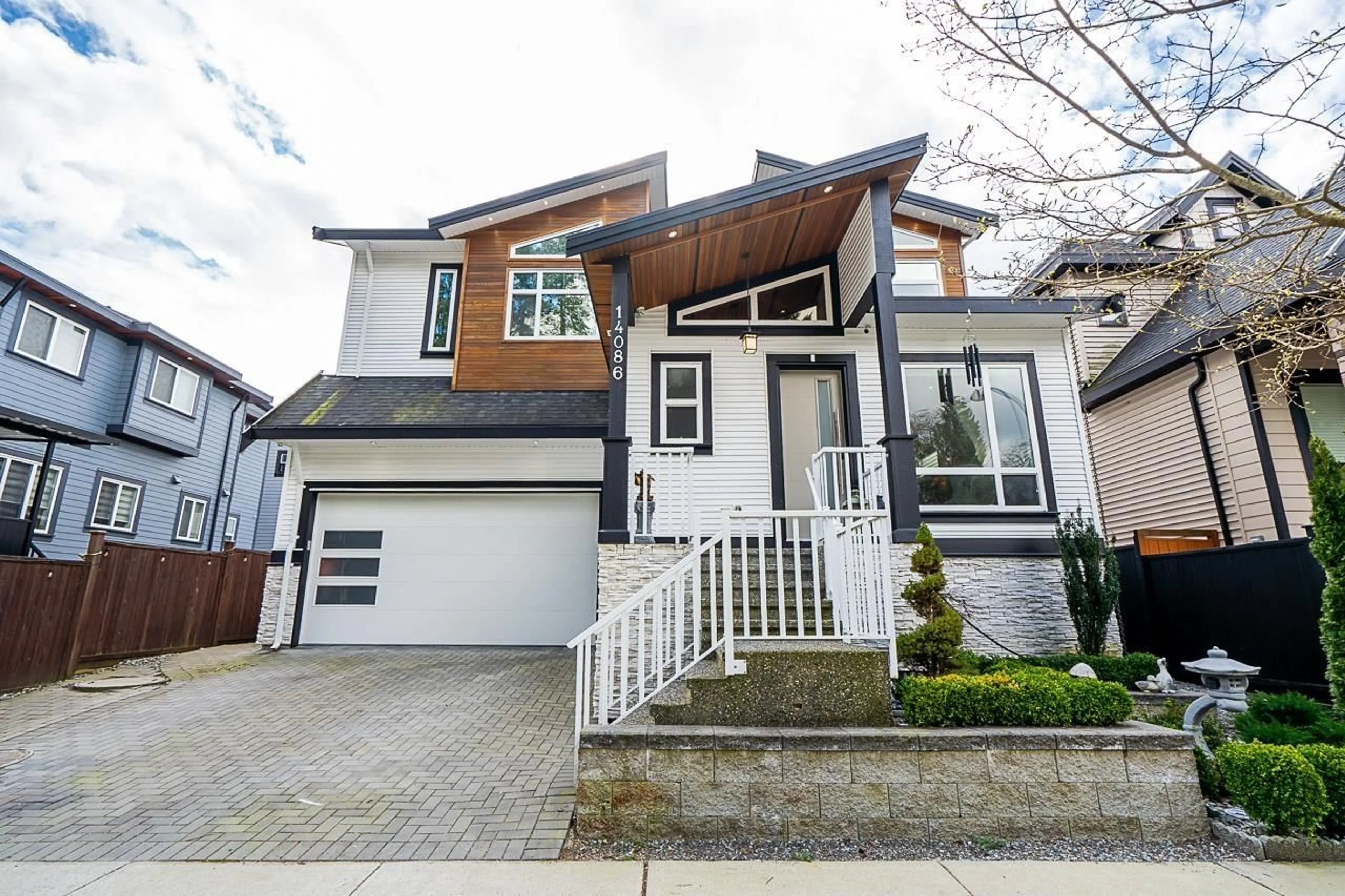 Frontside or backside of a home for 14086 58A AVENUE, Surrey British Columbia V3X2S1