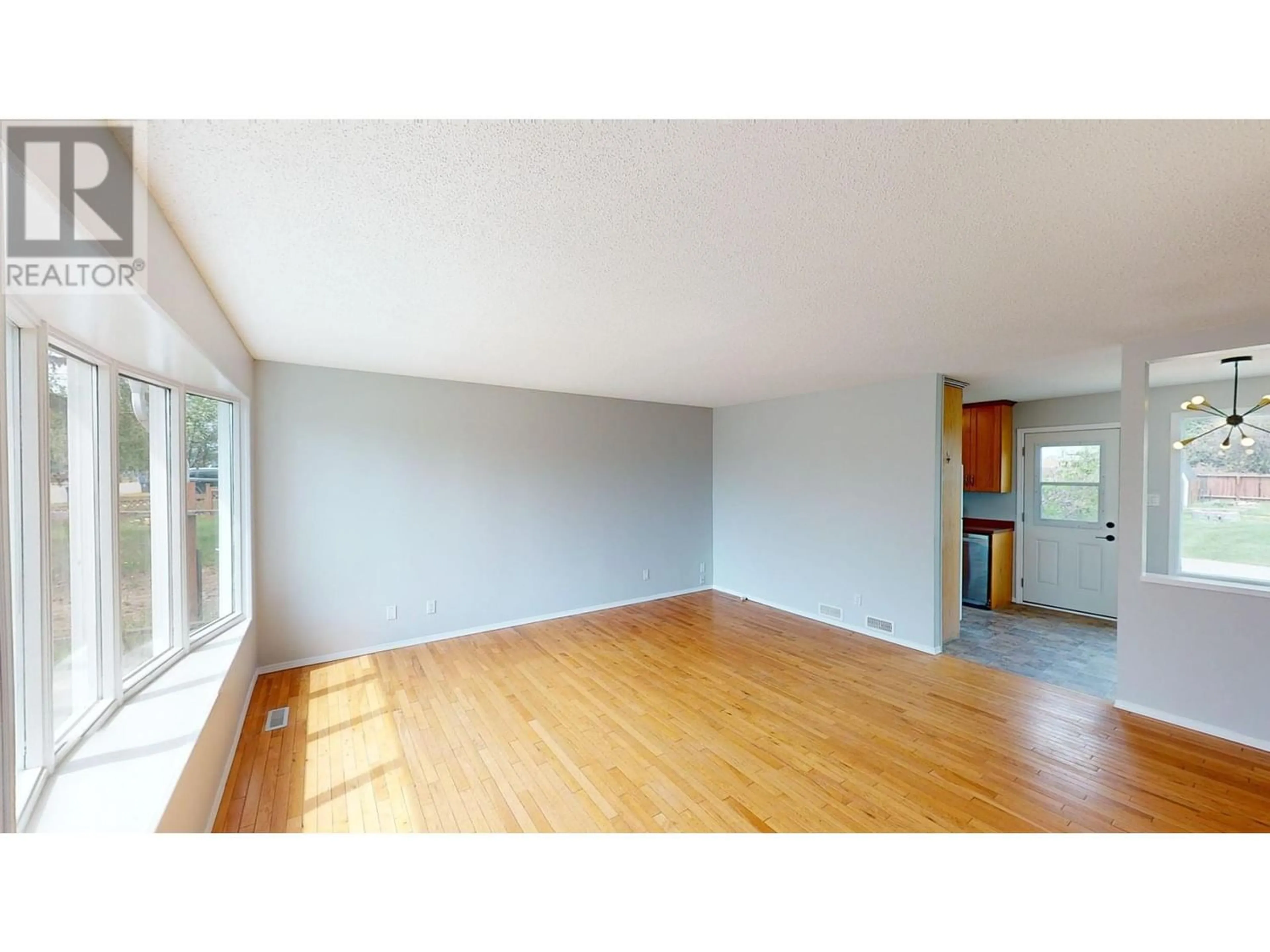 A pic of a room, wood floors for 8106 98 AVENUE, Fort St. John British Columbia V1J1P3