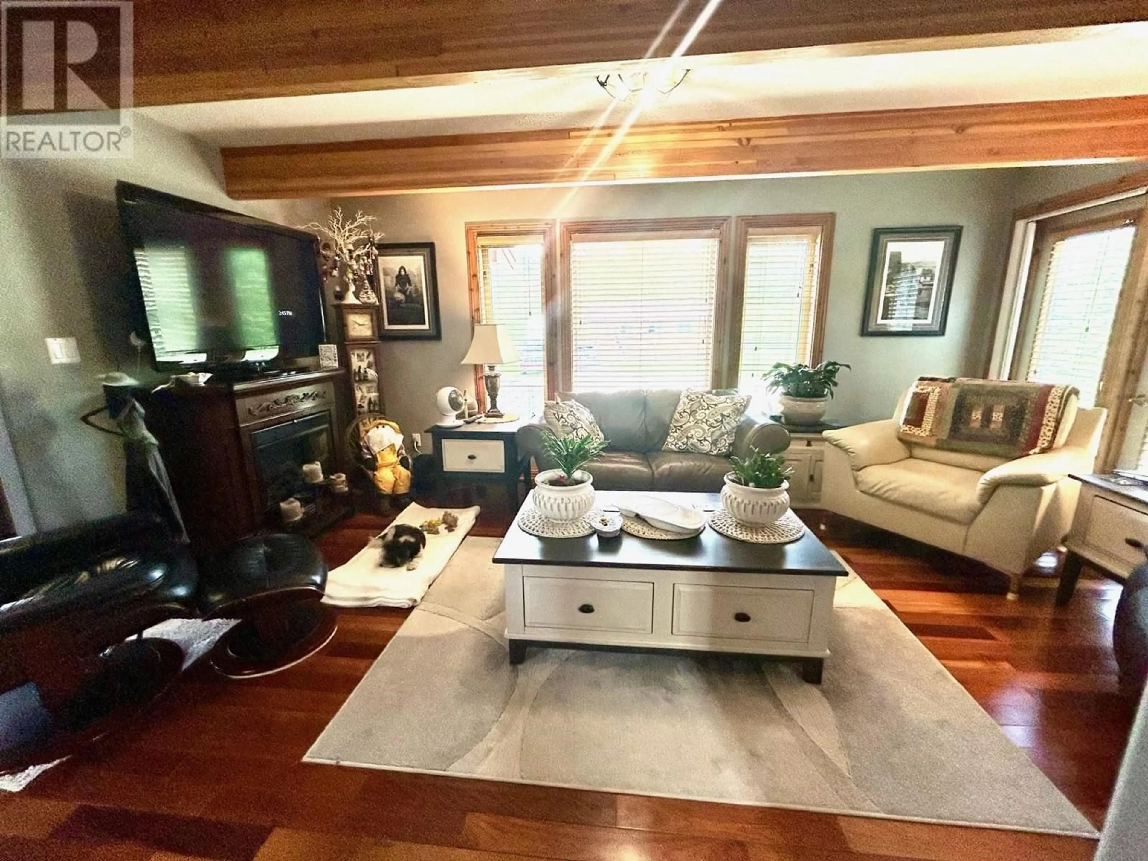 Living room with furniture, wood/laminate floor for 58 RADAR ROAD, Fort Nelson - Remote British Columbia V0C1R0