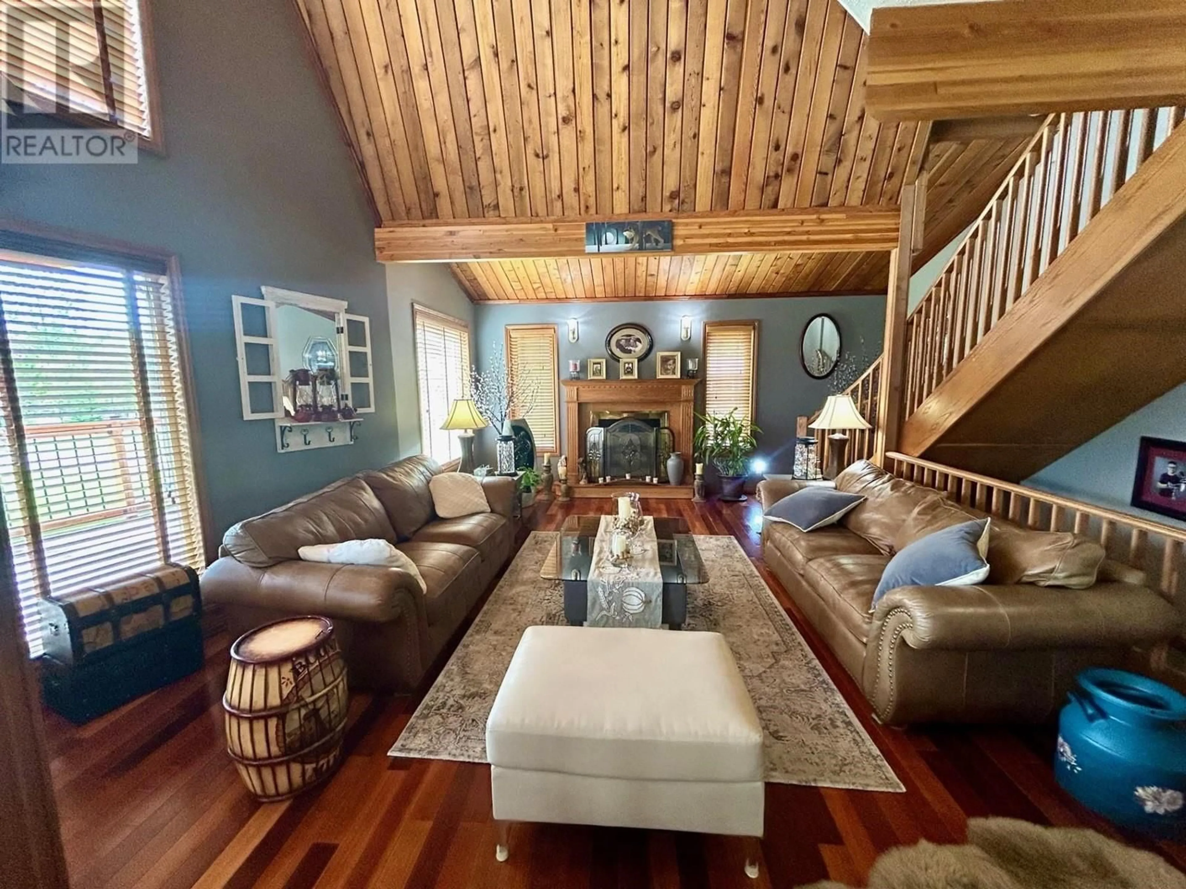 Living room with furniture, wood/laminate floor for 58 RADAR ROAD, Fort Nelson - Remote British Columbia V0C1R0