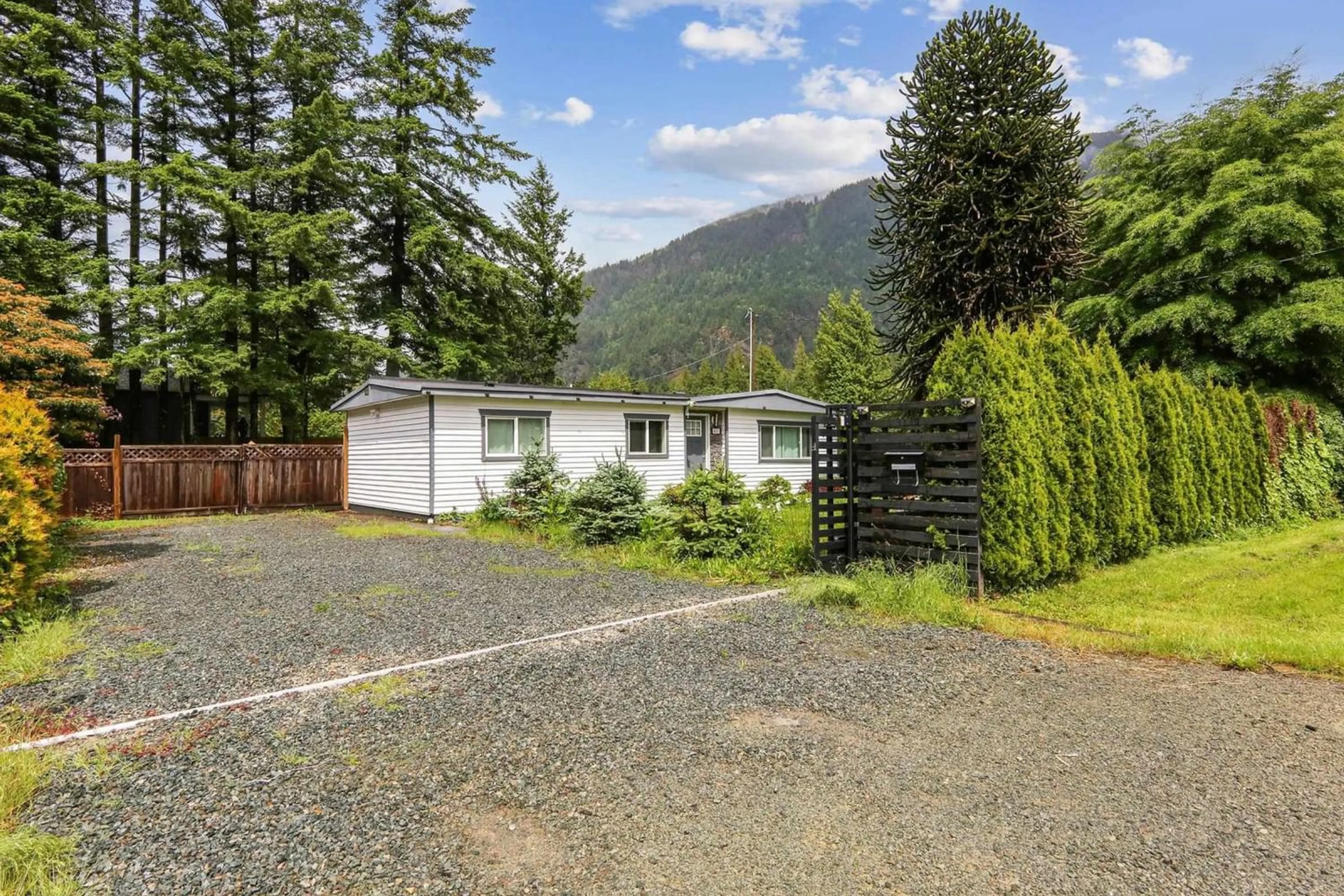 A pic from exterior of the house or condo, the fenced backyard for 411 EMERALD AVENUE, Harrison Hot Springs British Columbia V0M1K0