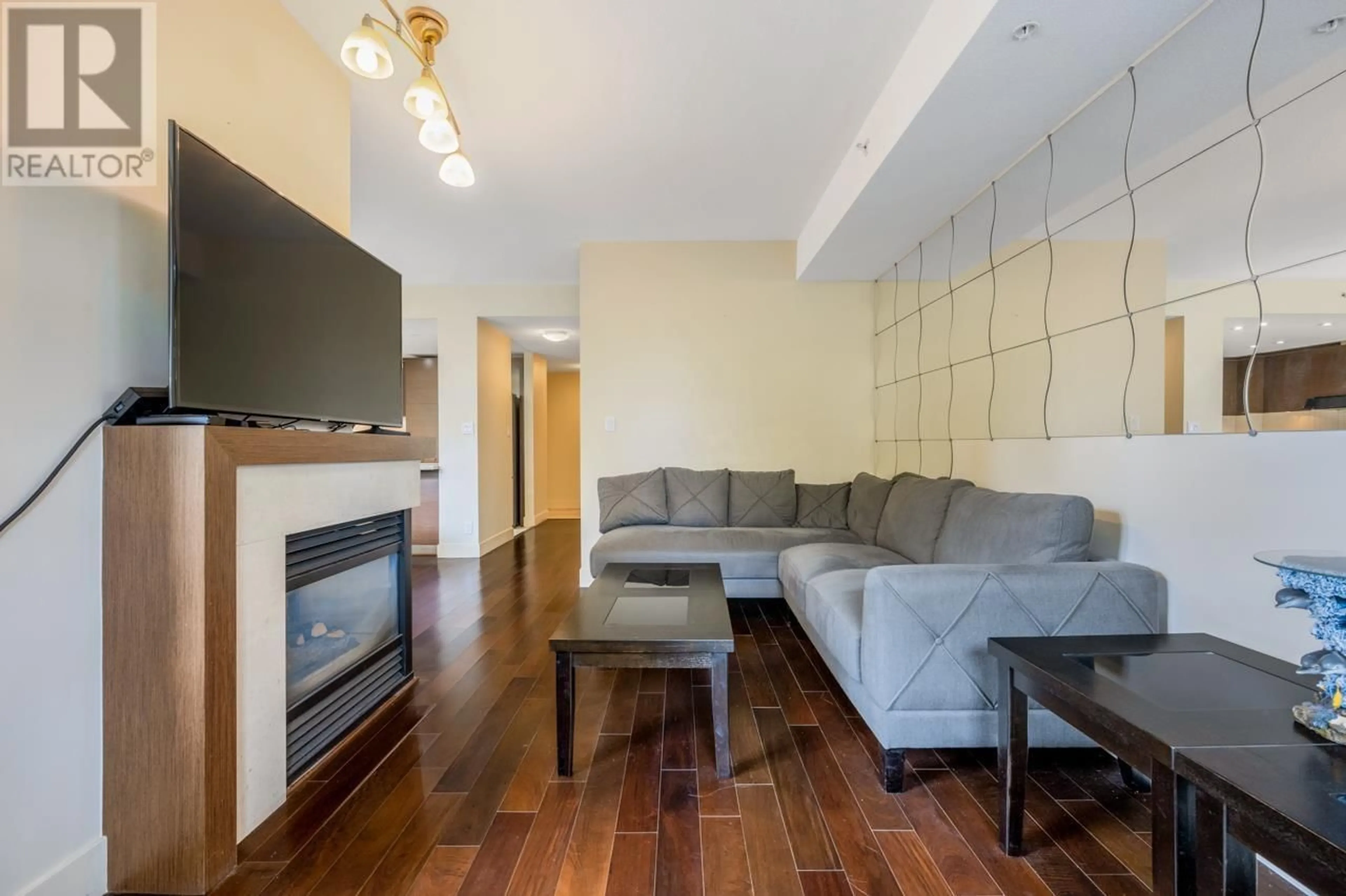 Living room with furniture, wood/laminate floor for 112 - 5958 IONA DRIVE, Vancouver British Columbia V6T2L2