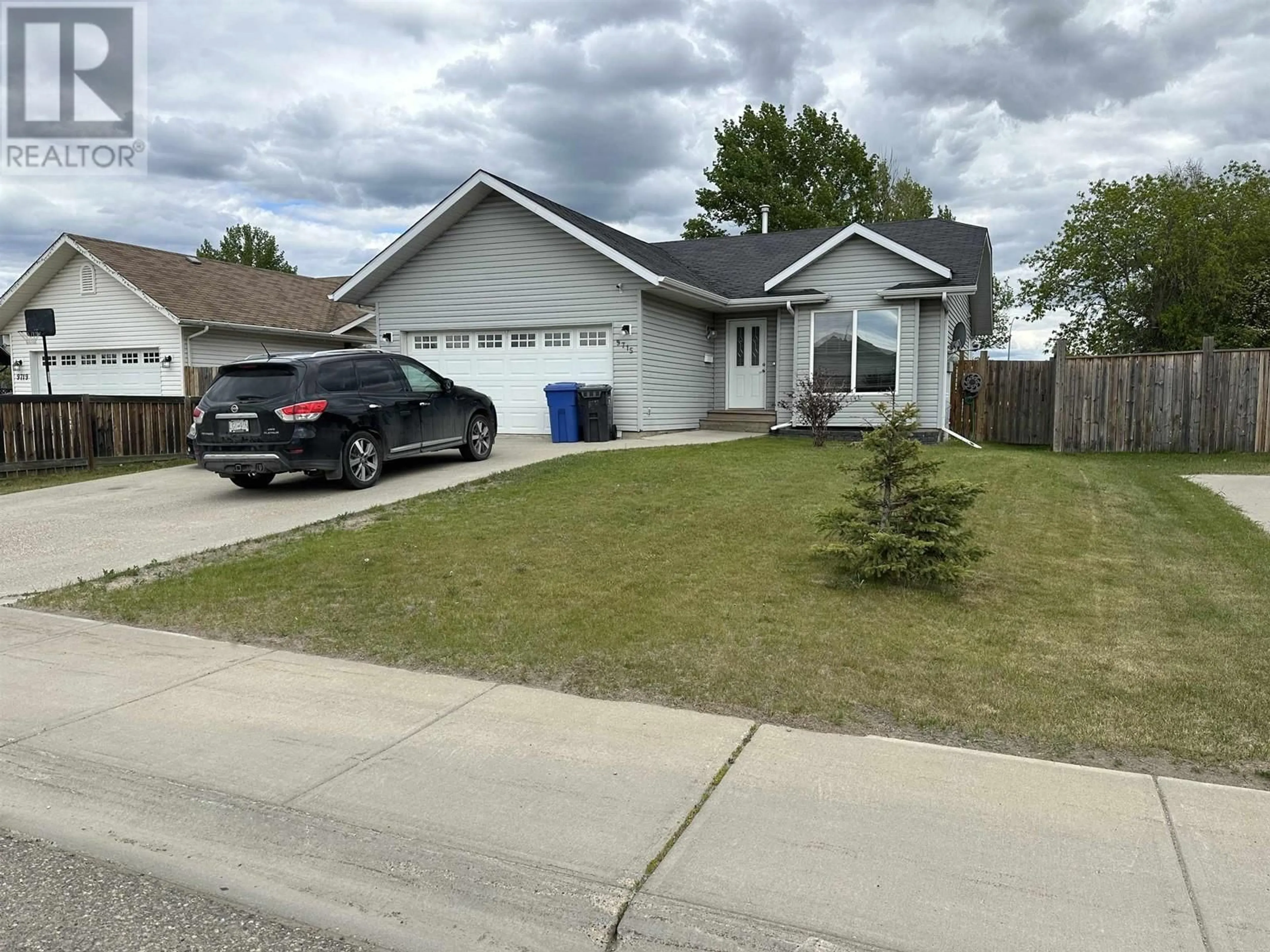 Frontside or backside of a home for 9715 88 STREET, Fort St. John British Columbia V1J0C1