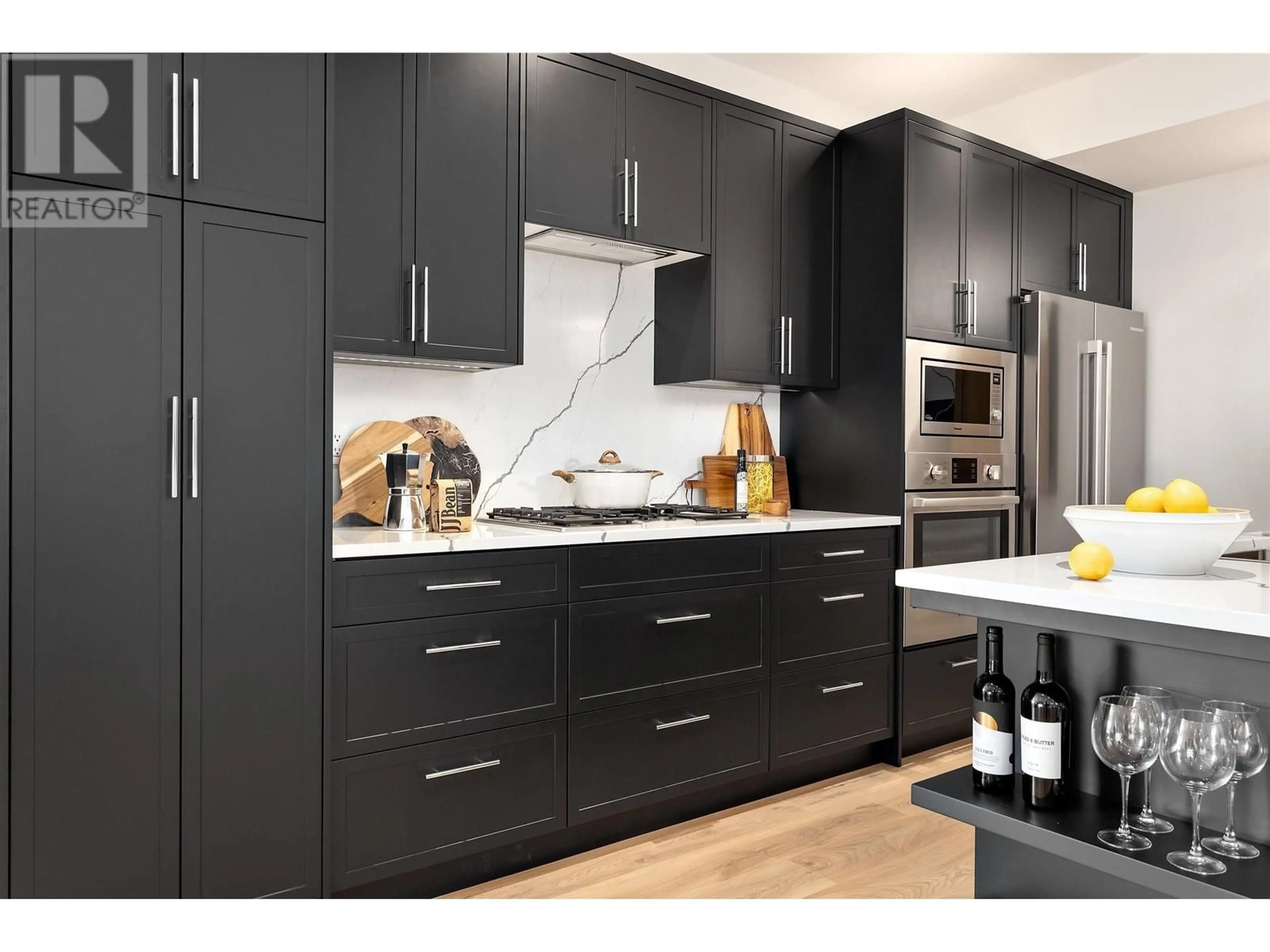 Contemporary kitchen, wood/laminate floor for 303 - 4437 HASTINGS STREET, Burnaby British Columbia V5C2K1