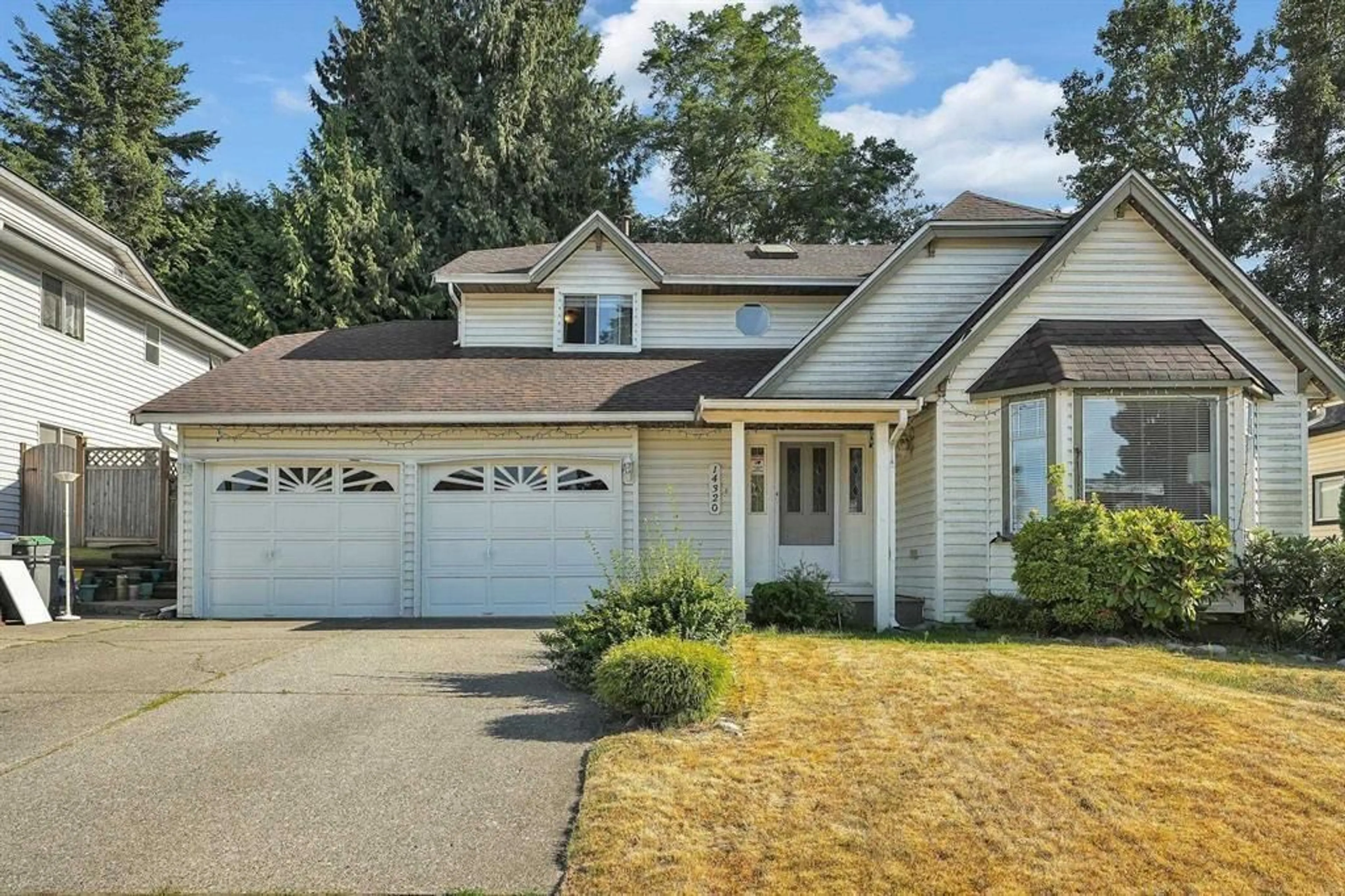 Frontside or backside of a home for 14320 77A AVENUE, Surrey British Columbia V3W0L2