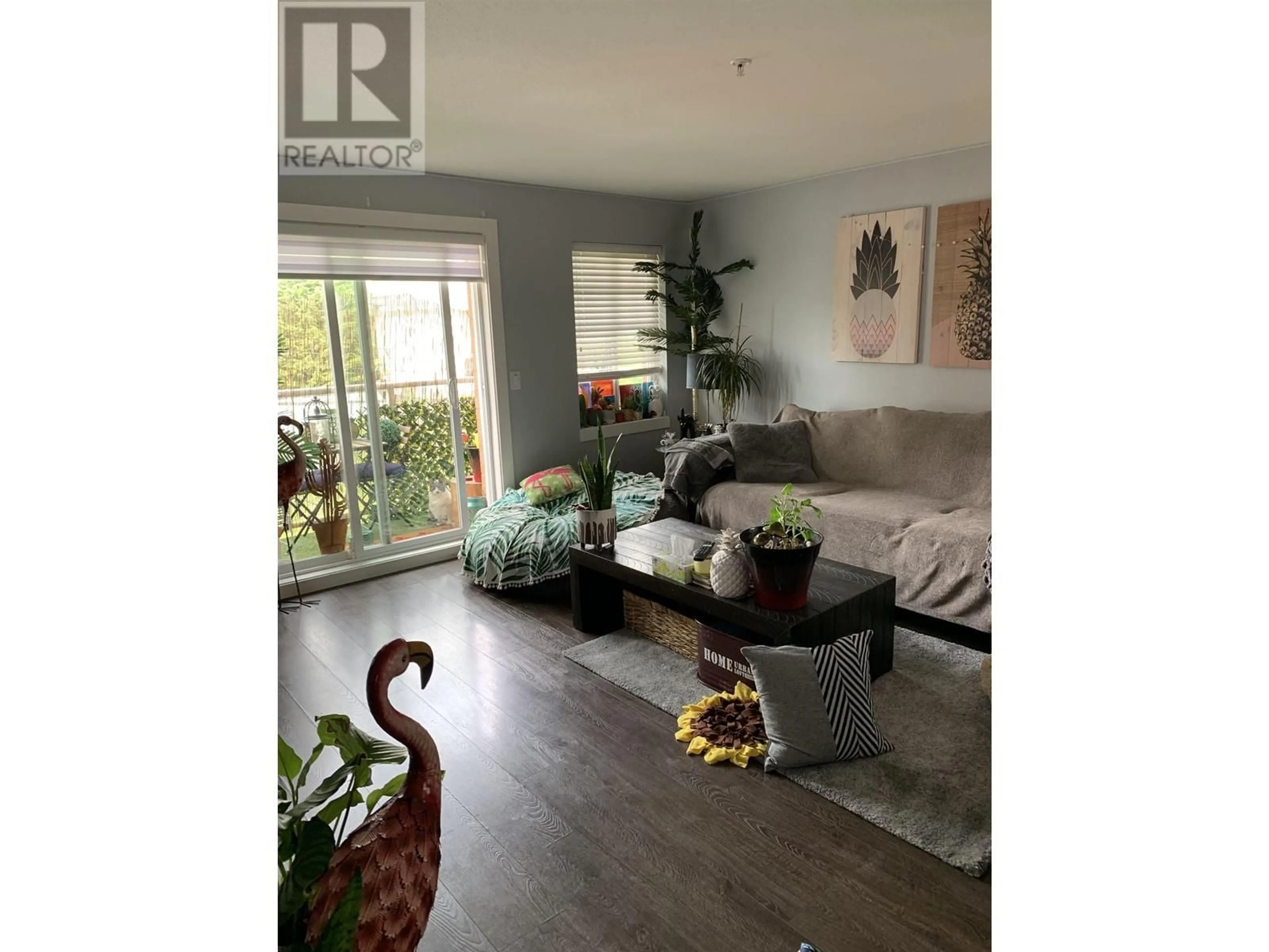 Living room with furniture, wood/laminate floor for 305 - 1990 WESTMINSTER AVENUE, Port Coquitlam British Columbia V3B1E8