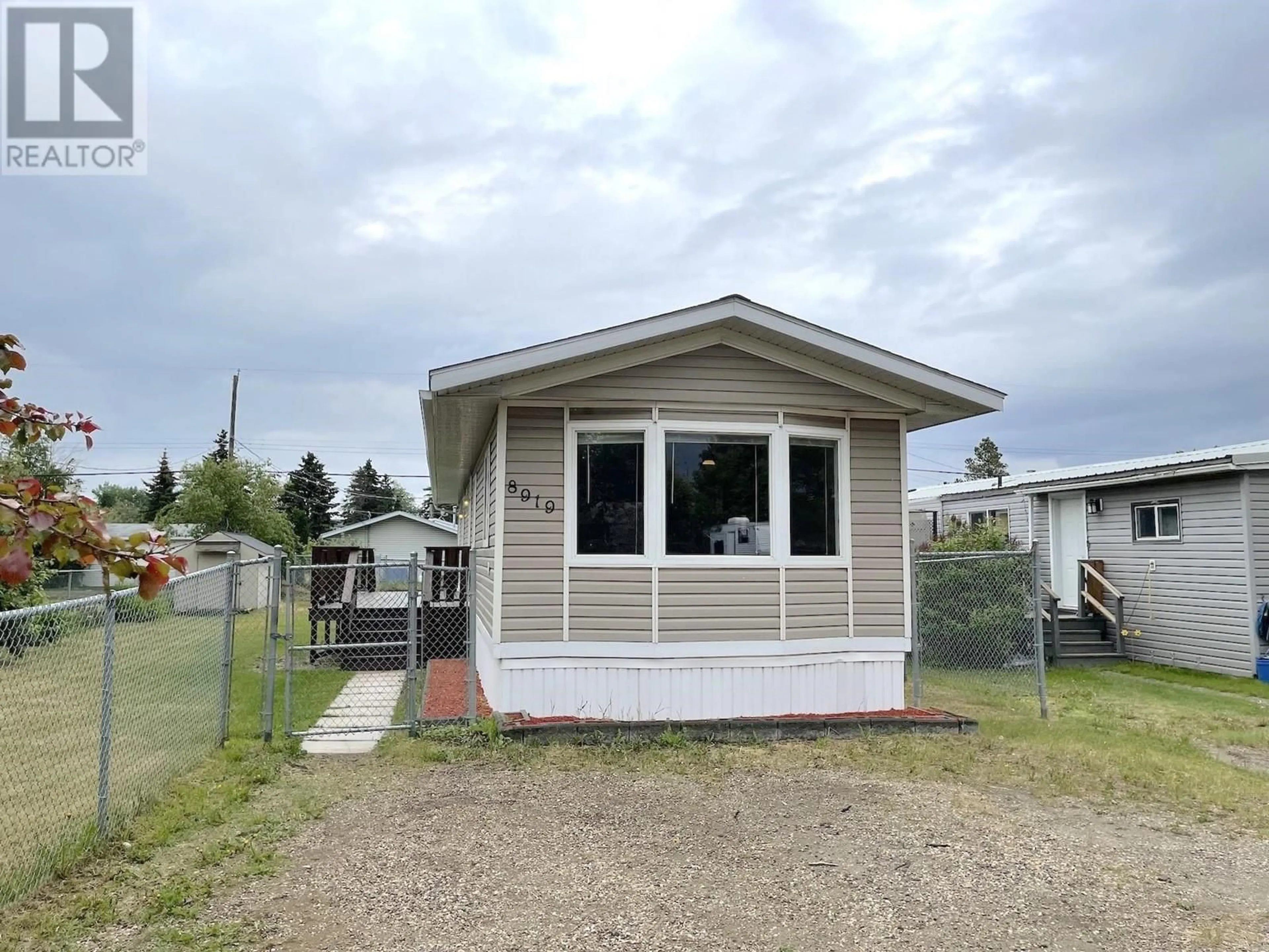 Home with vinyl exterior material for 8919 77 STREET, Fort St. John British Columbia V1J3A5