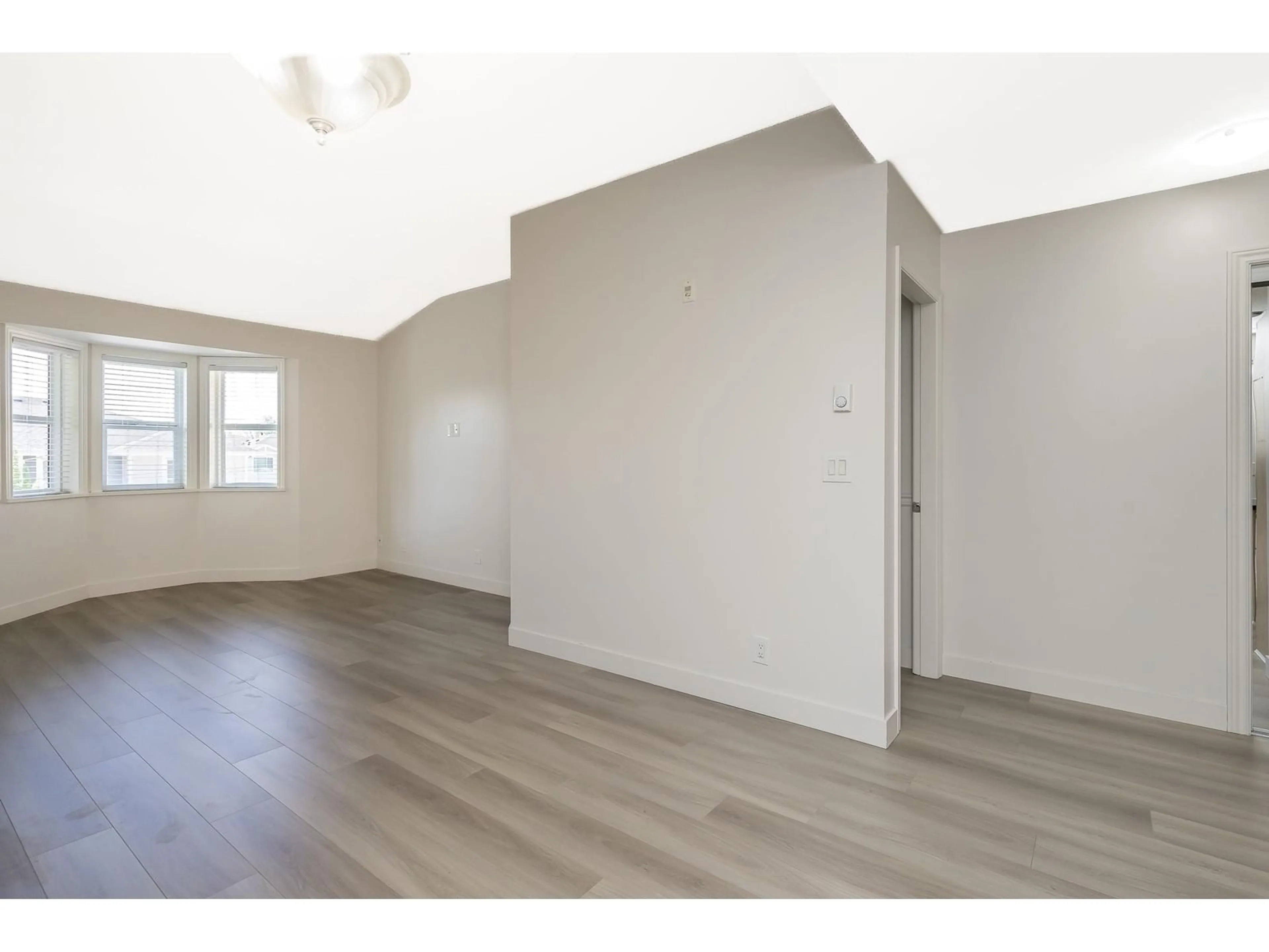 A pic of a room, wood floors for 306 19774 56TH AVENUE, Langley British Columbia V3A3X6