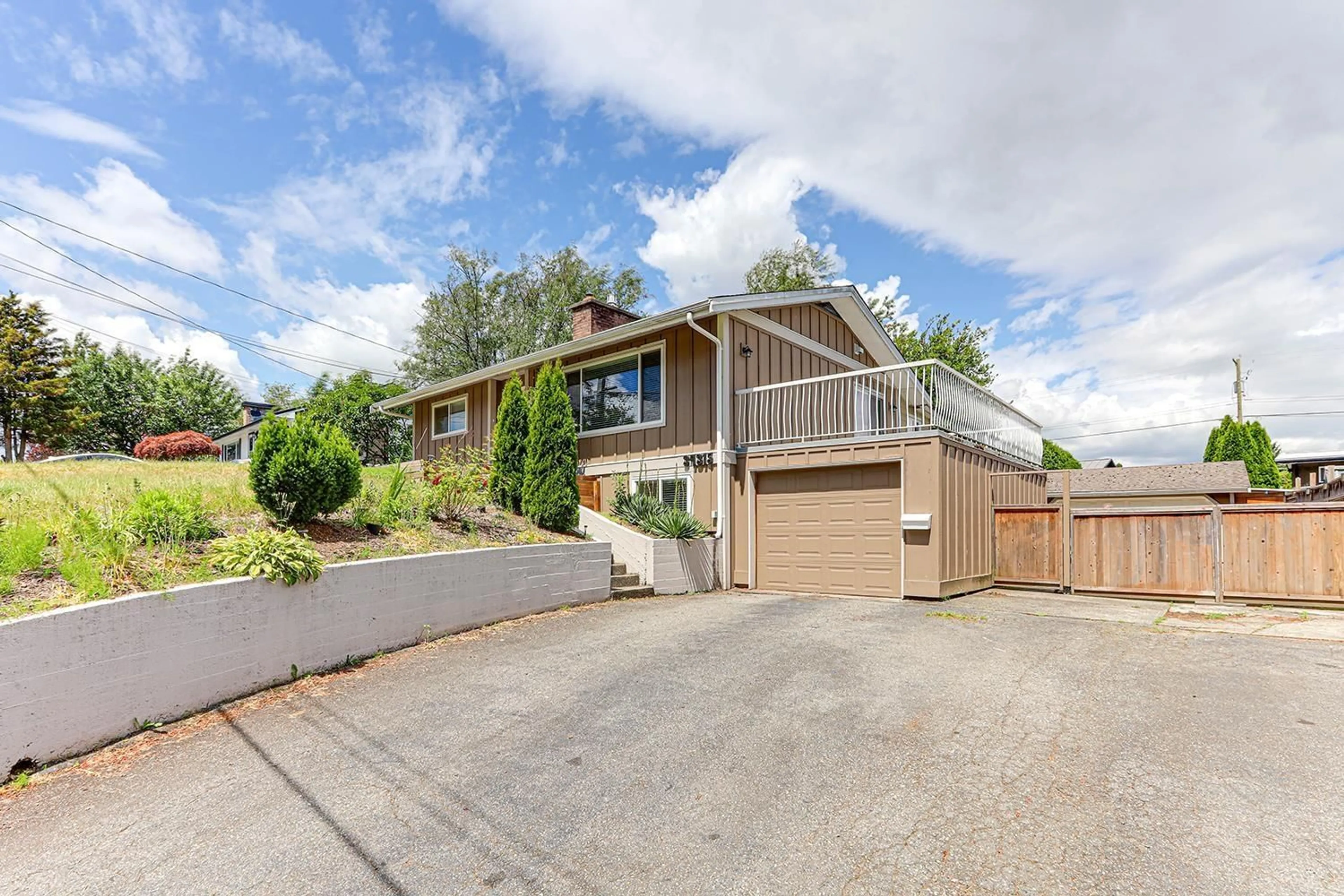 Frontside or backside of a home, the fenced backyard for 34315 FRASER STREET, Abbotsford British Columbia V2S1X8