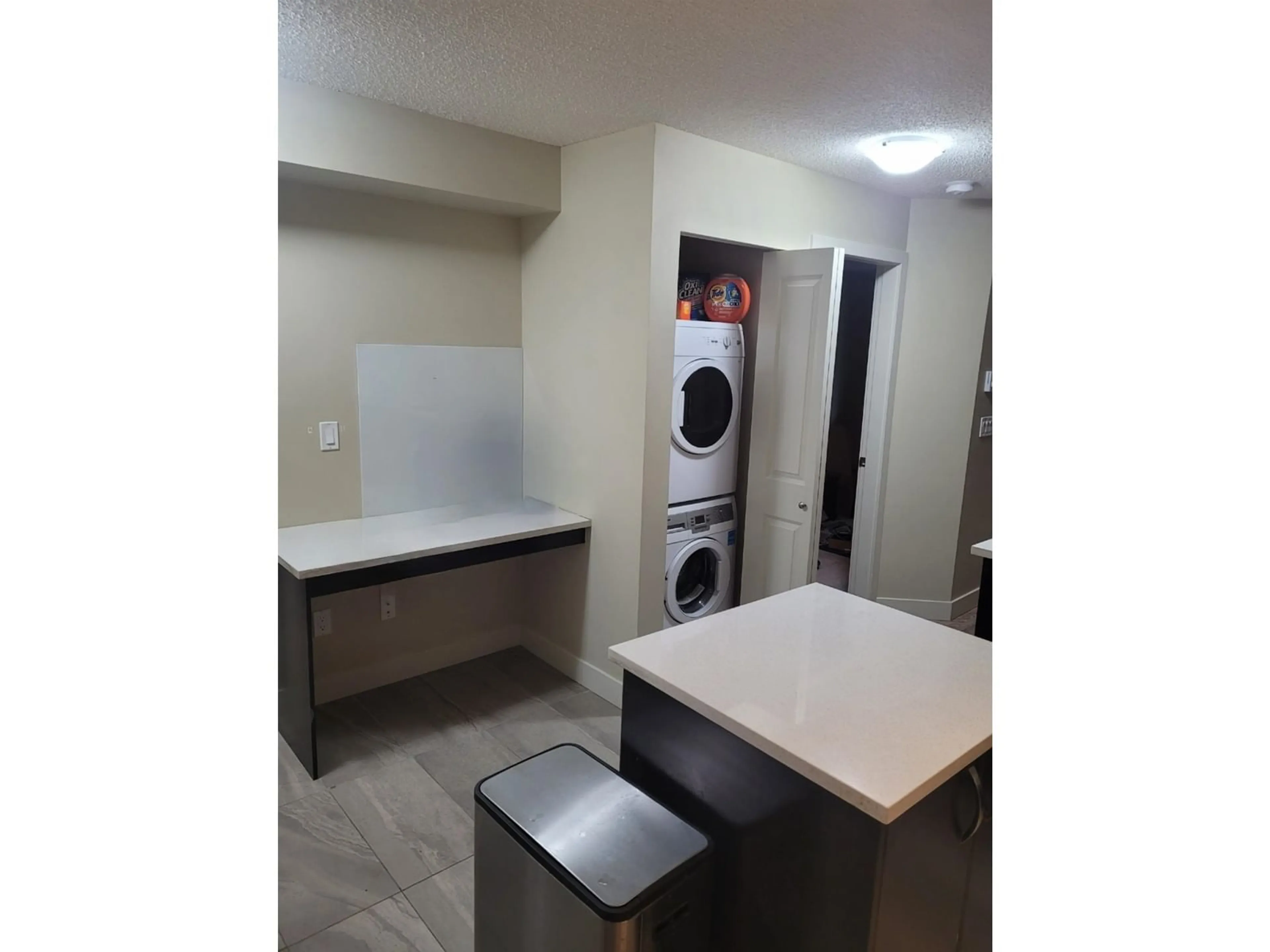 Kitchen with laundary machines for 236 10838 CITY PARKWAY, Surrey British Columbia V3T5X9