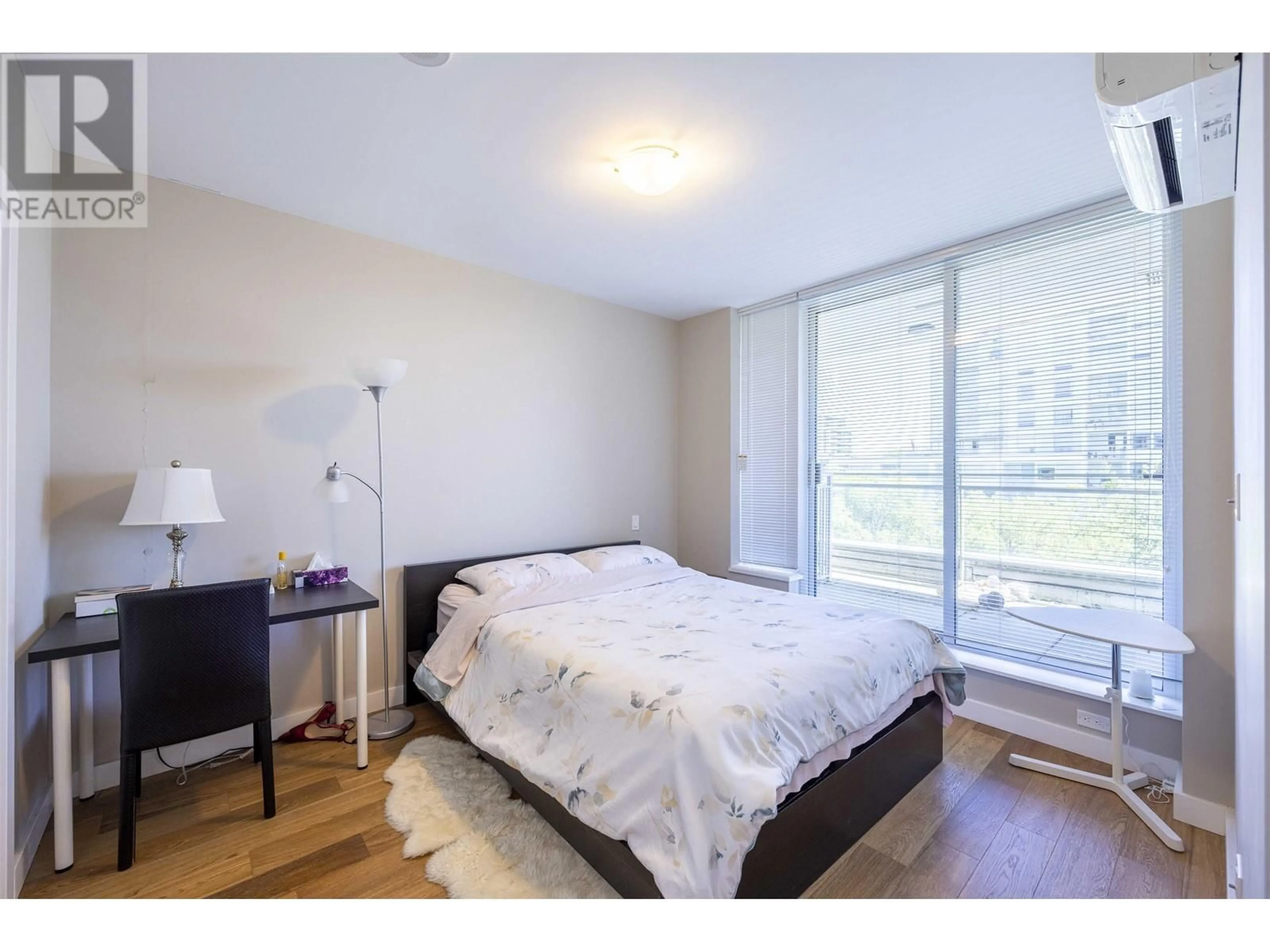 Bedroom with bed, wood/laminate floor for 6009 - 5511 HOLLYBRIDGE WAY, Richmond British Columbia V7C0A3