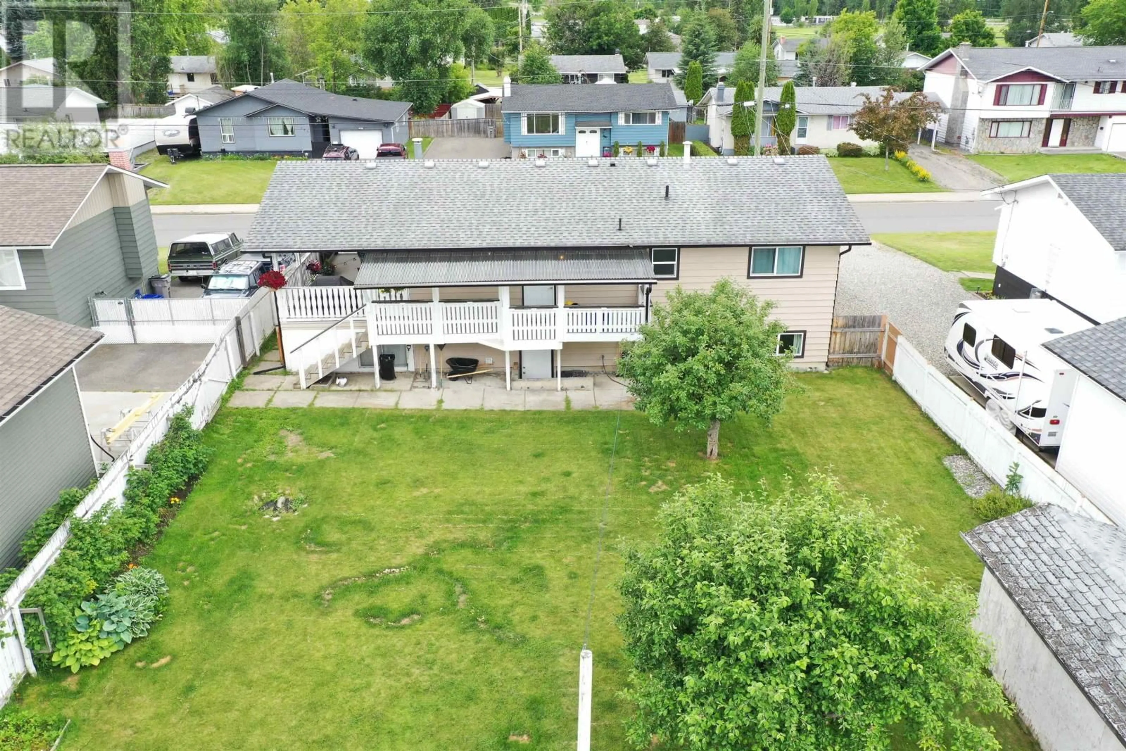 Frontside or backside of a home, the fenced backyard for 359 RITCHIE AVENUE, Quesnel British Columbia V2J3L1