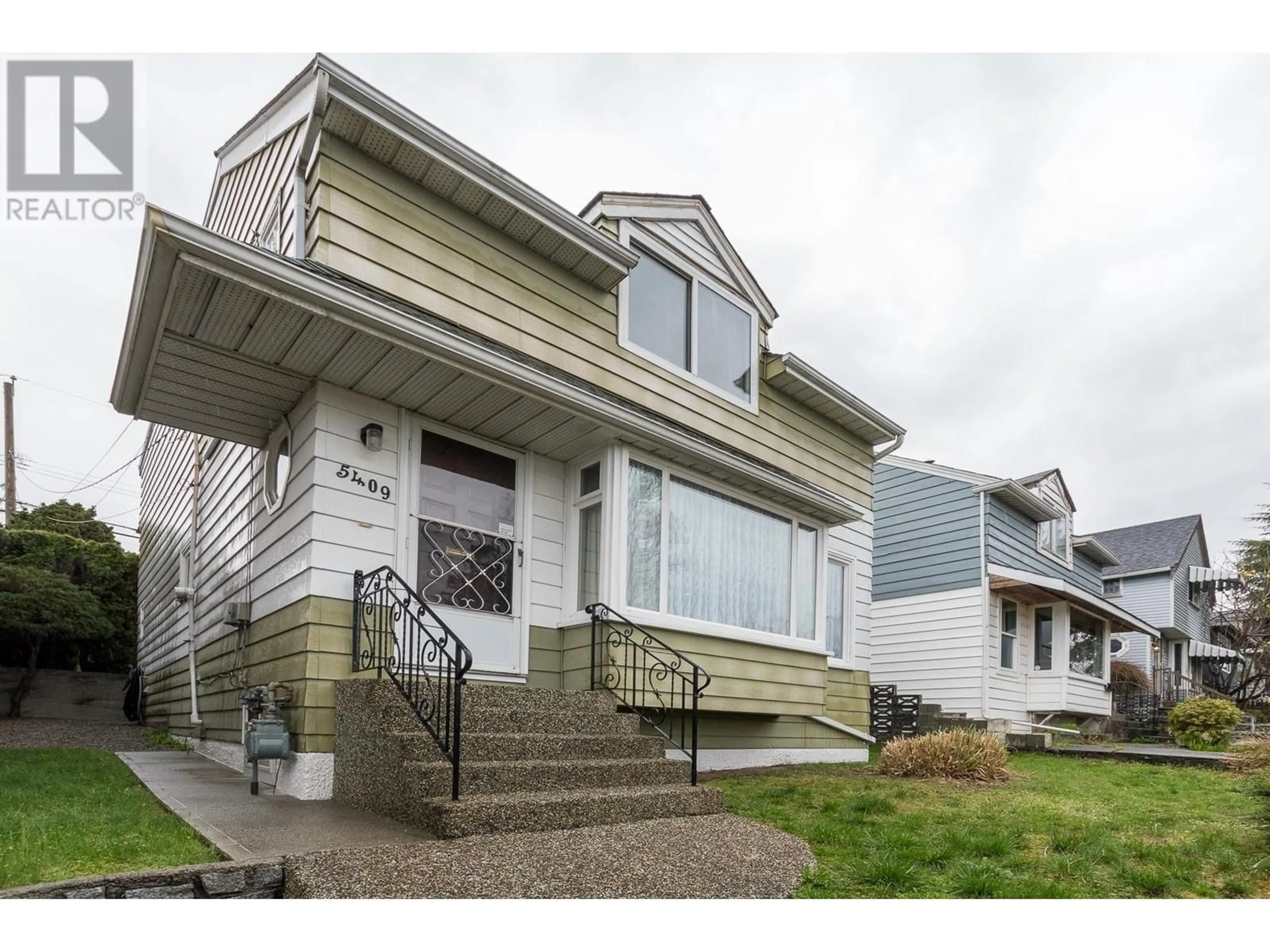 Frontside or backside of a home for 5409 KNIGHT STREET, Vancouver British Columbia V5P2T8