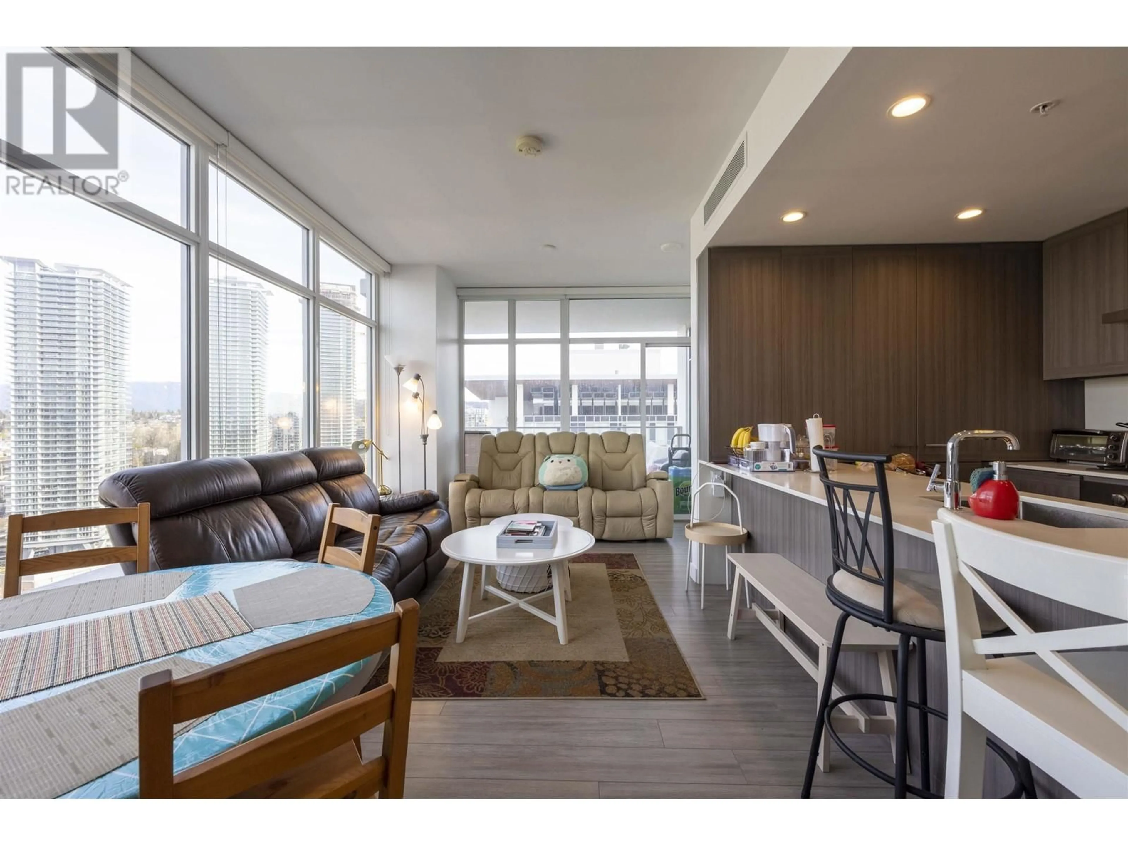 Living room with furniture, wood/laminate floor for 2805 - 2311 BETA AVENUE, Burnaby British Columbia V5C0M1