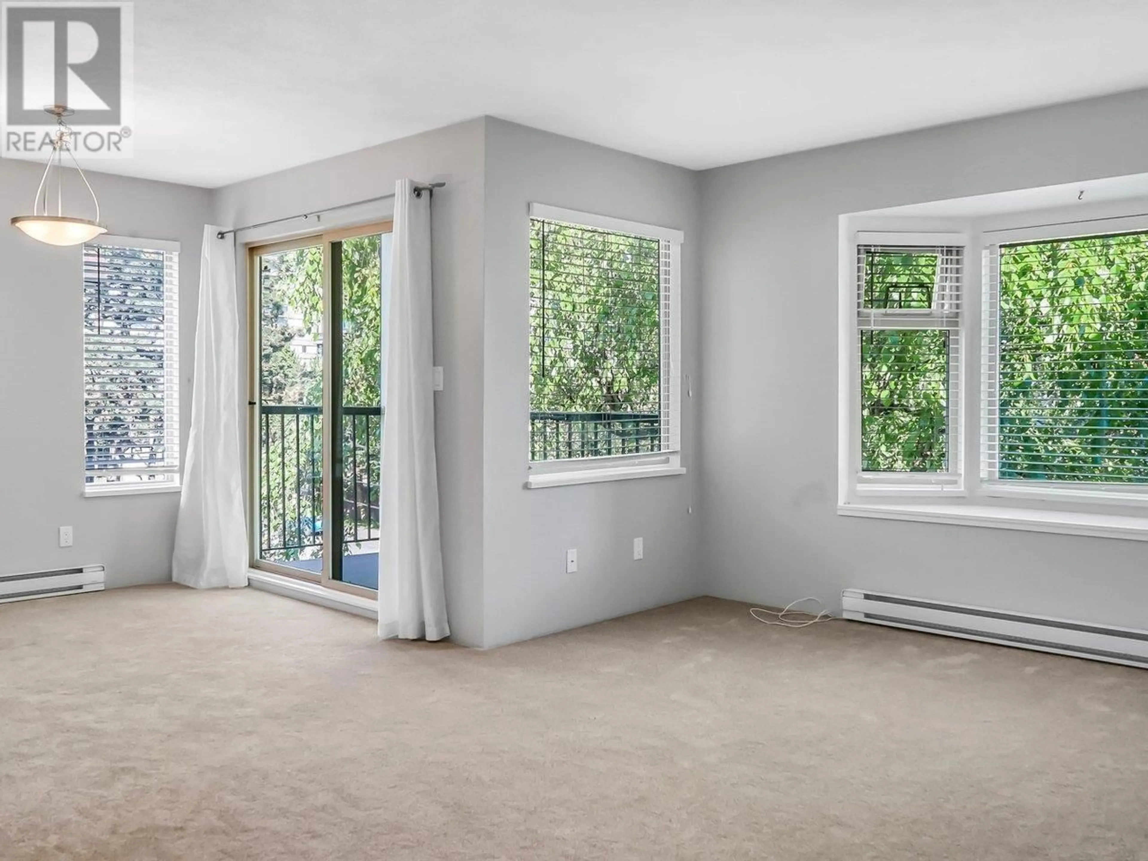 A pic of a room, carpet floors for 312 737 HAMILTON STREET, New Westminster British Columbia V3M2M7