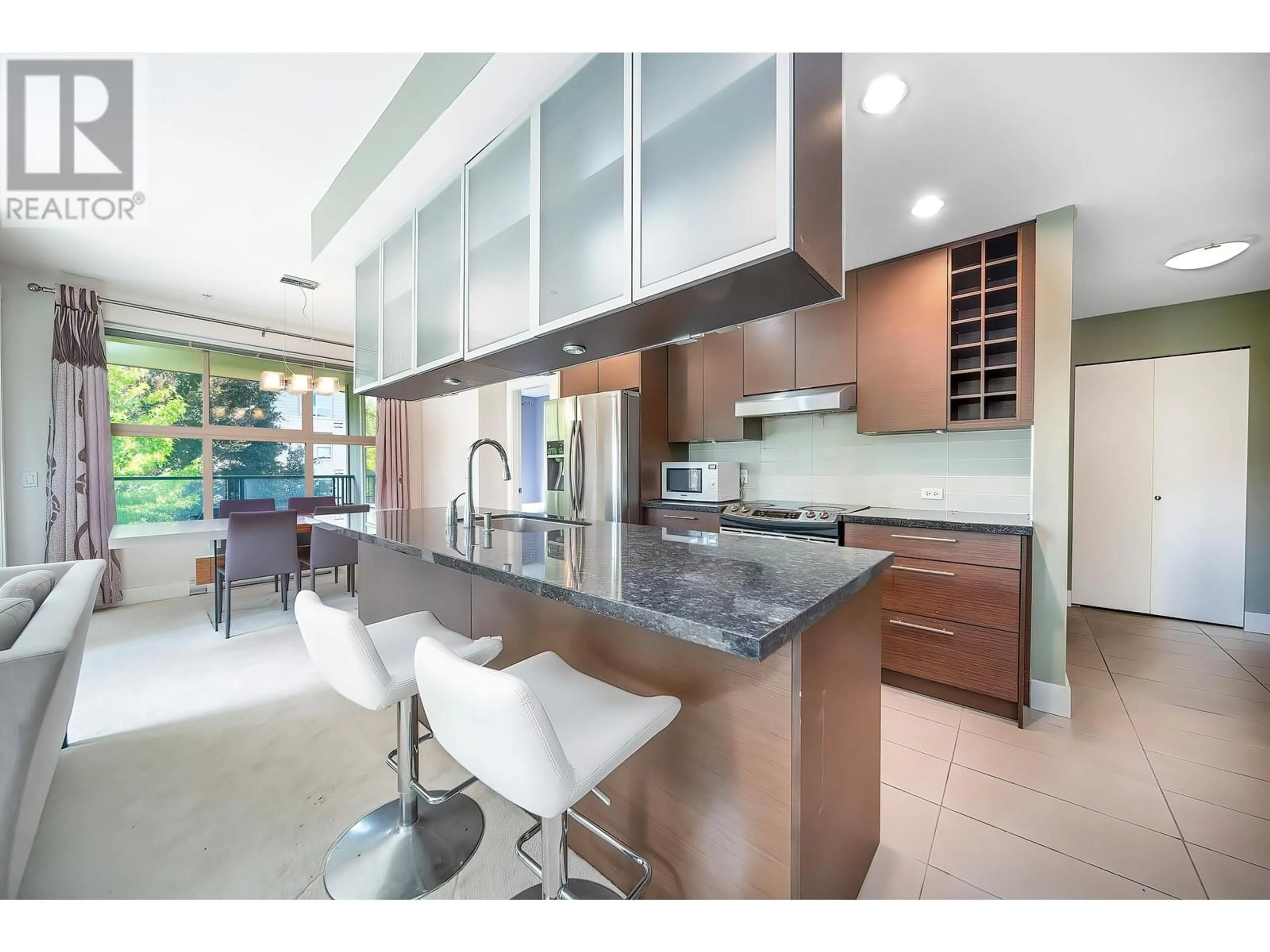 Contemporary kitchen, wood floors for 311 3478 WESBROOK MALL, Vancouver British Columbia V6S0B6