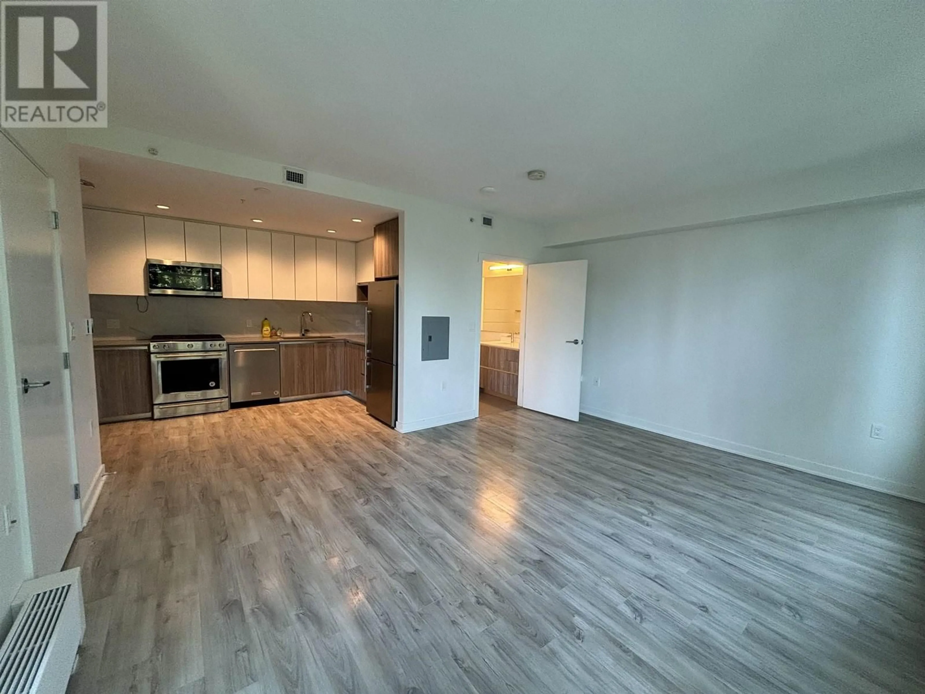 A pic of a room, wood floors for 801 8940 UNIVERSITY CRESCENT, Burnaby British Columbia V5A4Y8