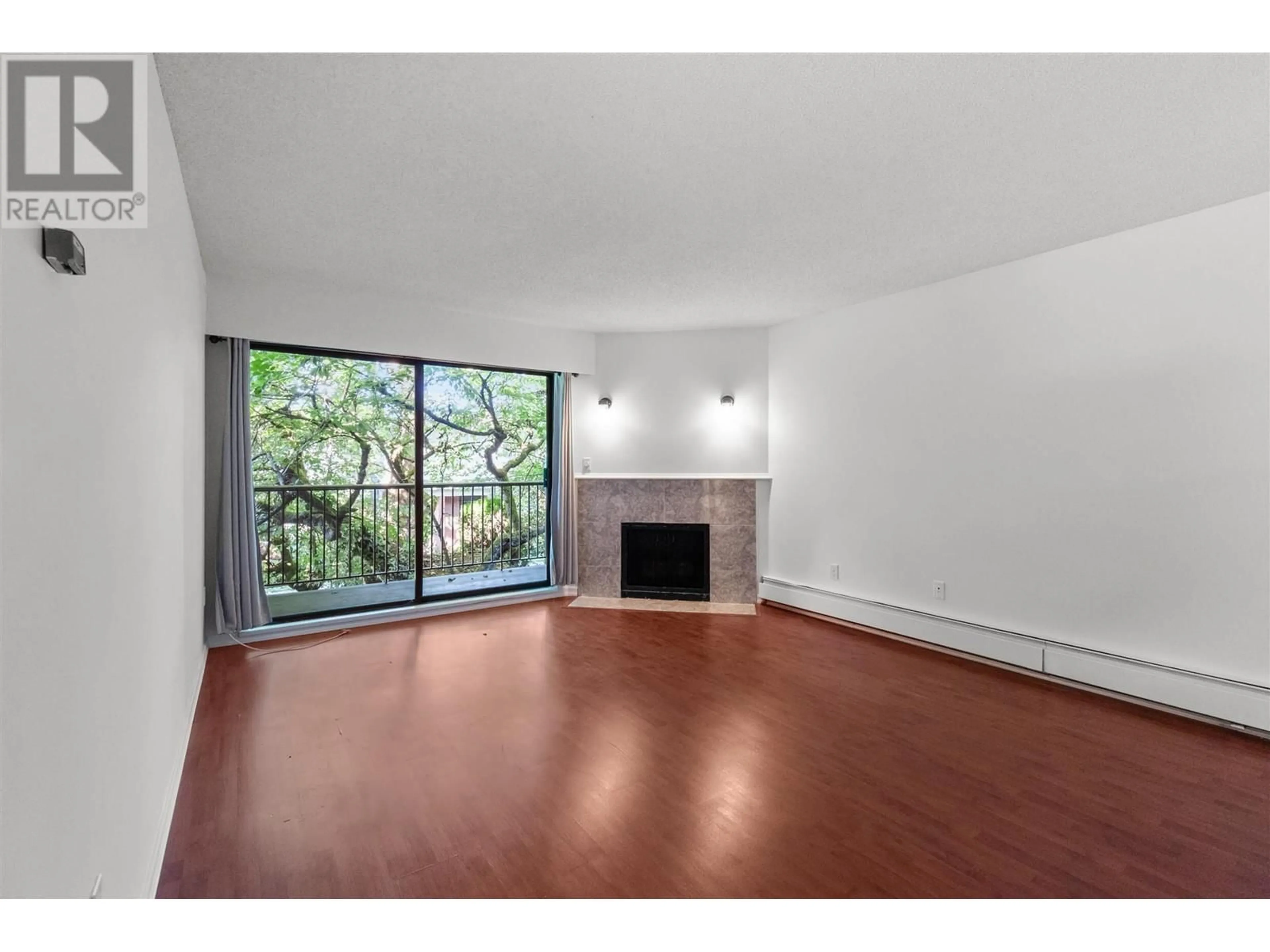 A pic of a room, wood floors for 214 9101 HORNE STREET, Burnaby British Columbia V3N4M3