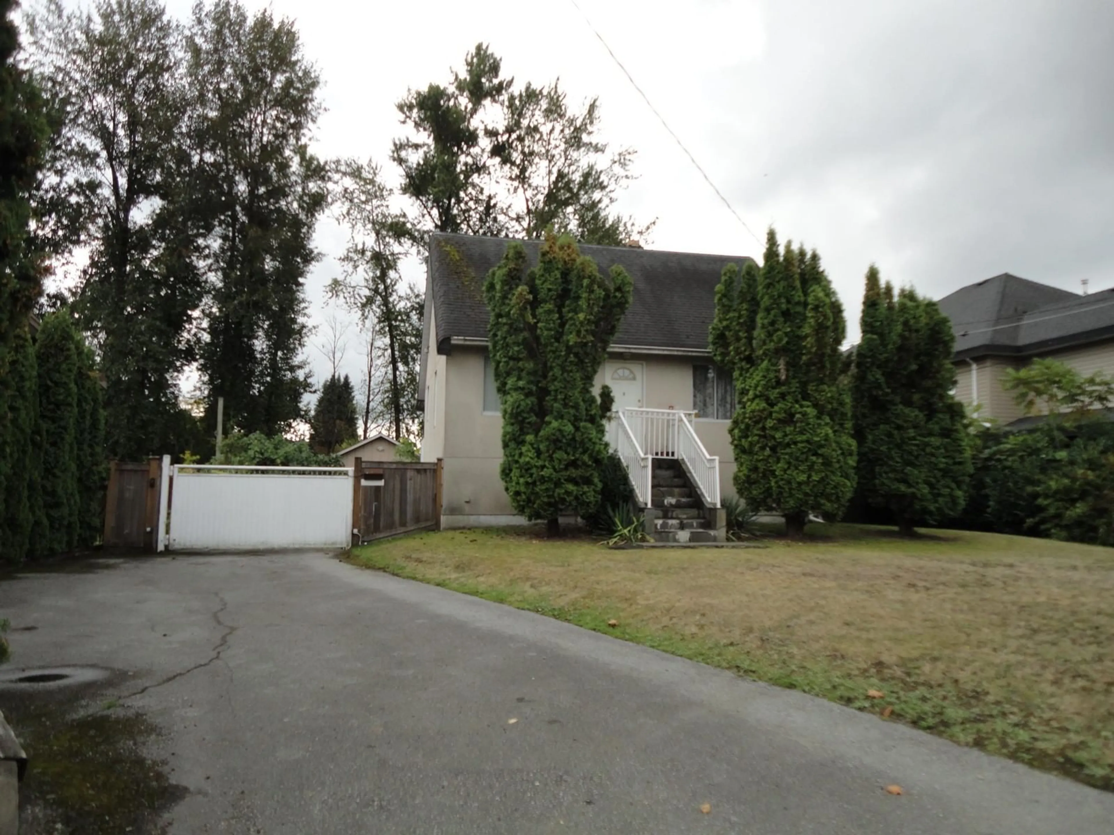 Frontside or backside of a home for 13268 96 AVENUE, Surrey British Columbia V3V1Y4