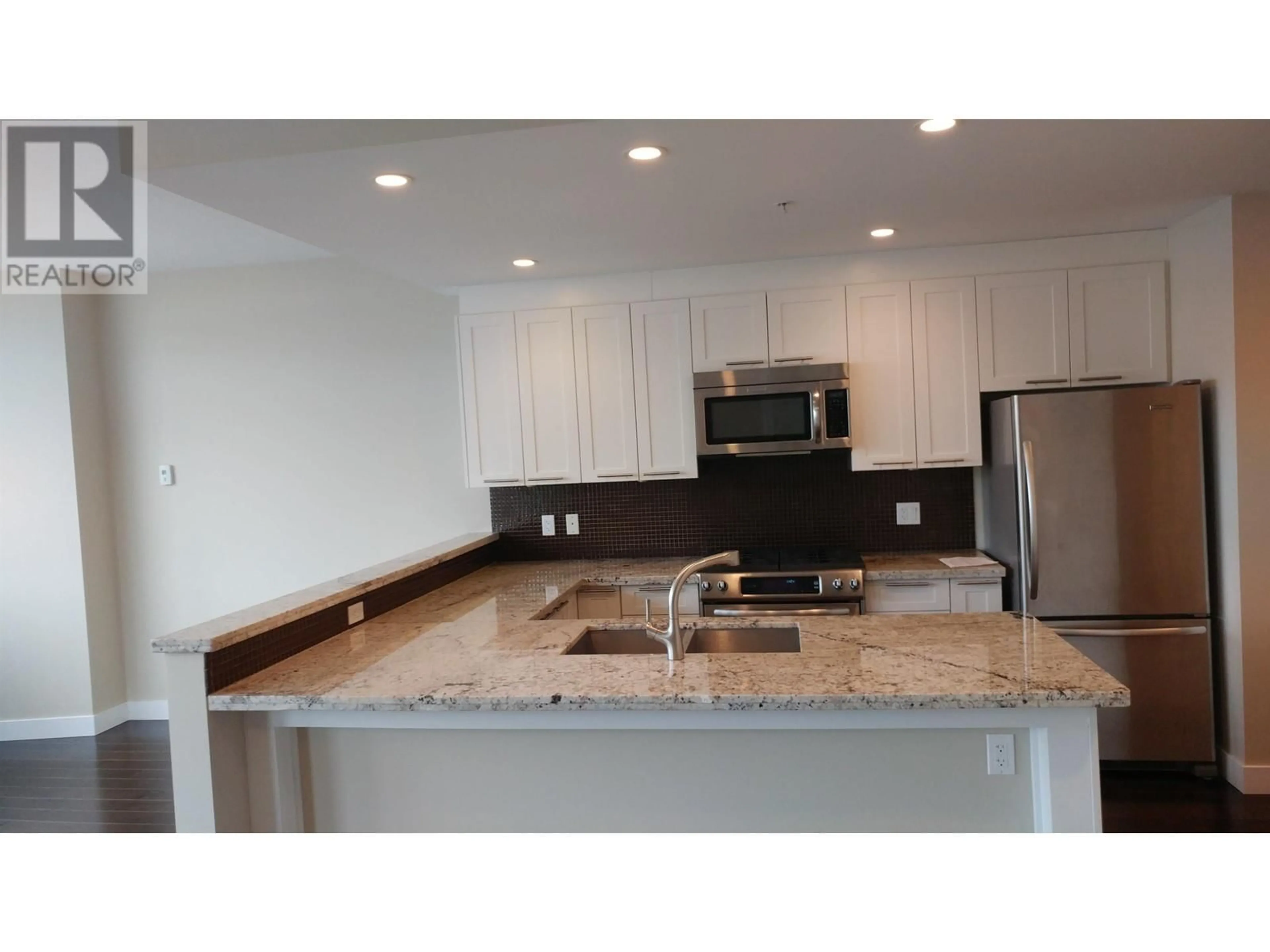 Open concept kitchen for 210 5725 TEREDO STREET, Sechelt British Columbia V7Z0J7