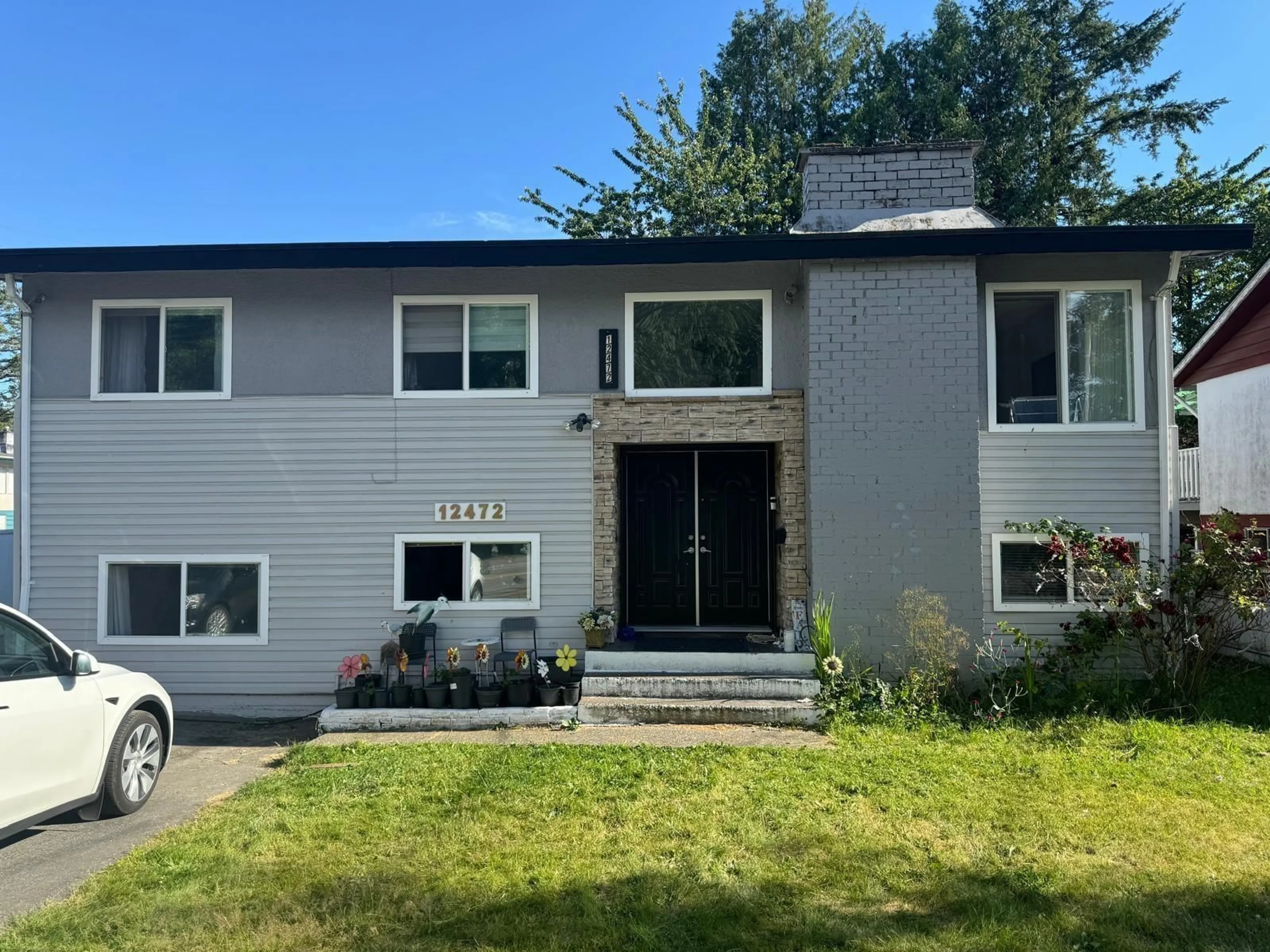 Frontside or backside of a home for 12472 100 AVENUE, Surrey British Columbia V3V2X5