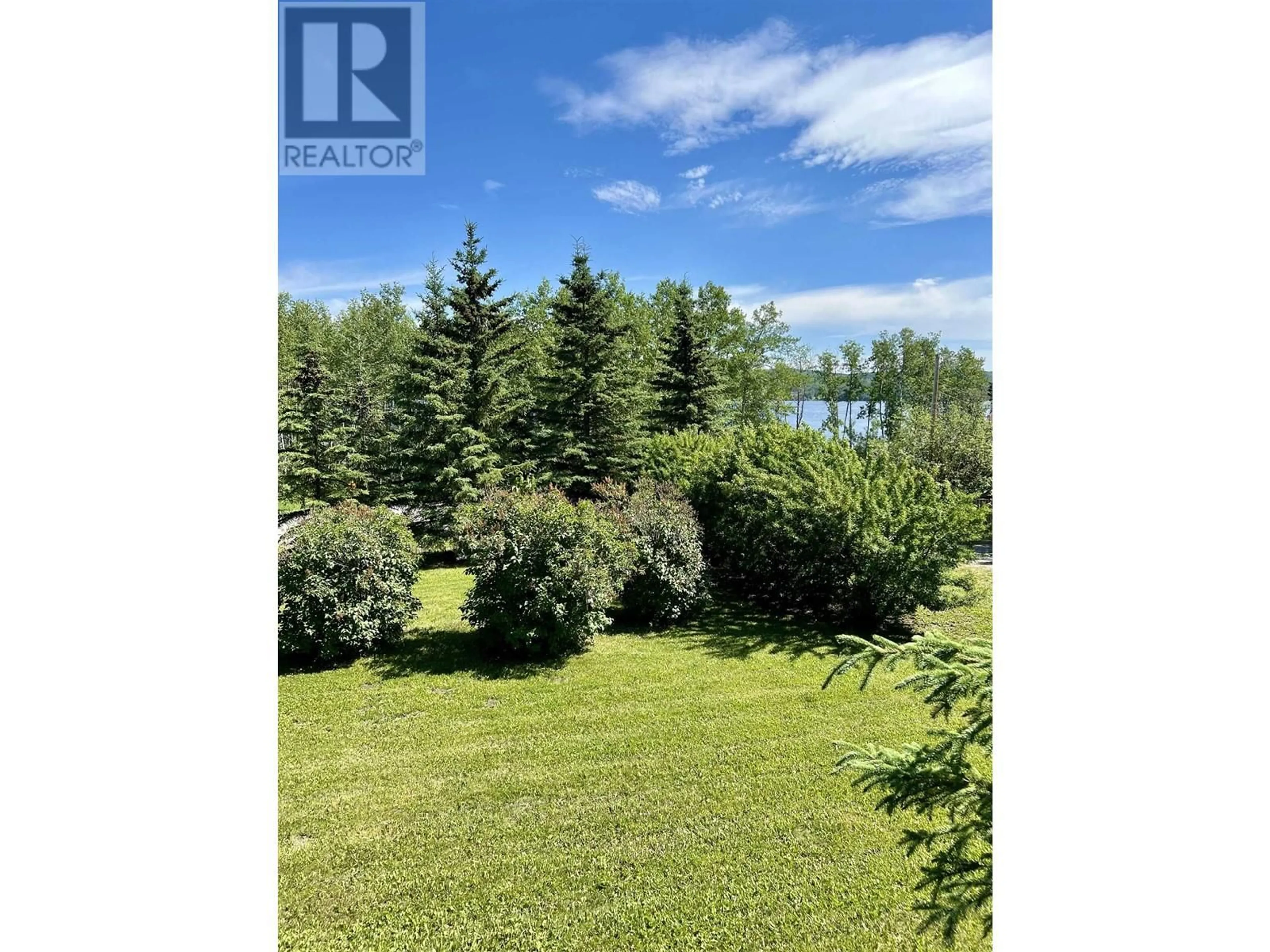 A pic from exterior of the house or condo, the fenced backyard for 13390 CHARLIE LAKE CRESCENT, Charlie Lake British Columbia V0C1H0