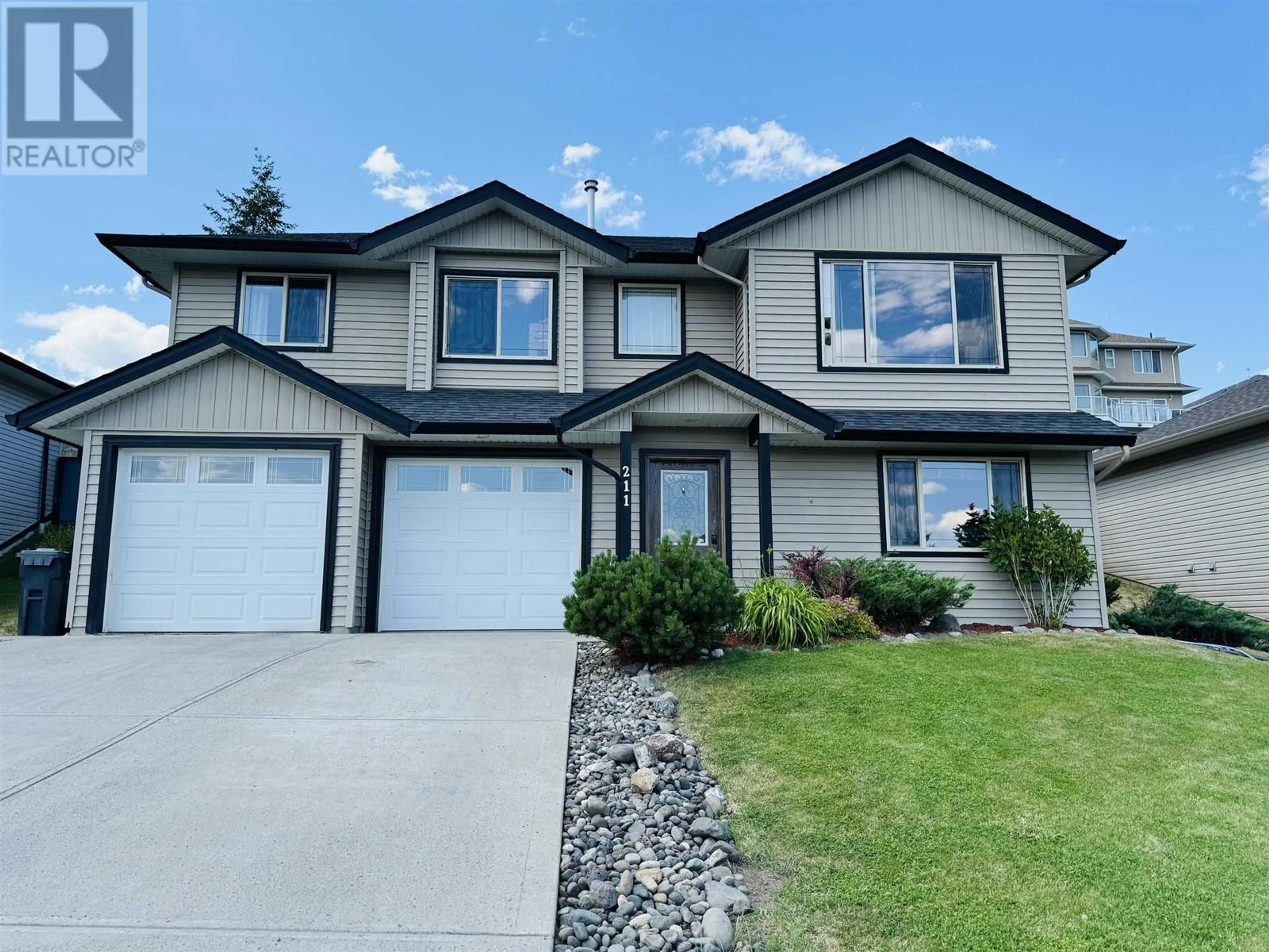 Frontside or backside of a home for 211 FOSTER WAY, Williams Lake British Columbia V2G5J1