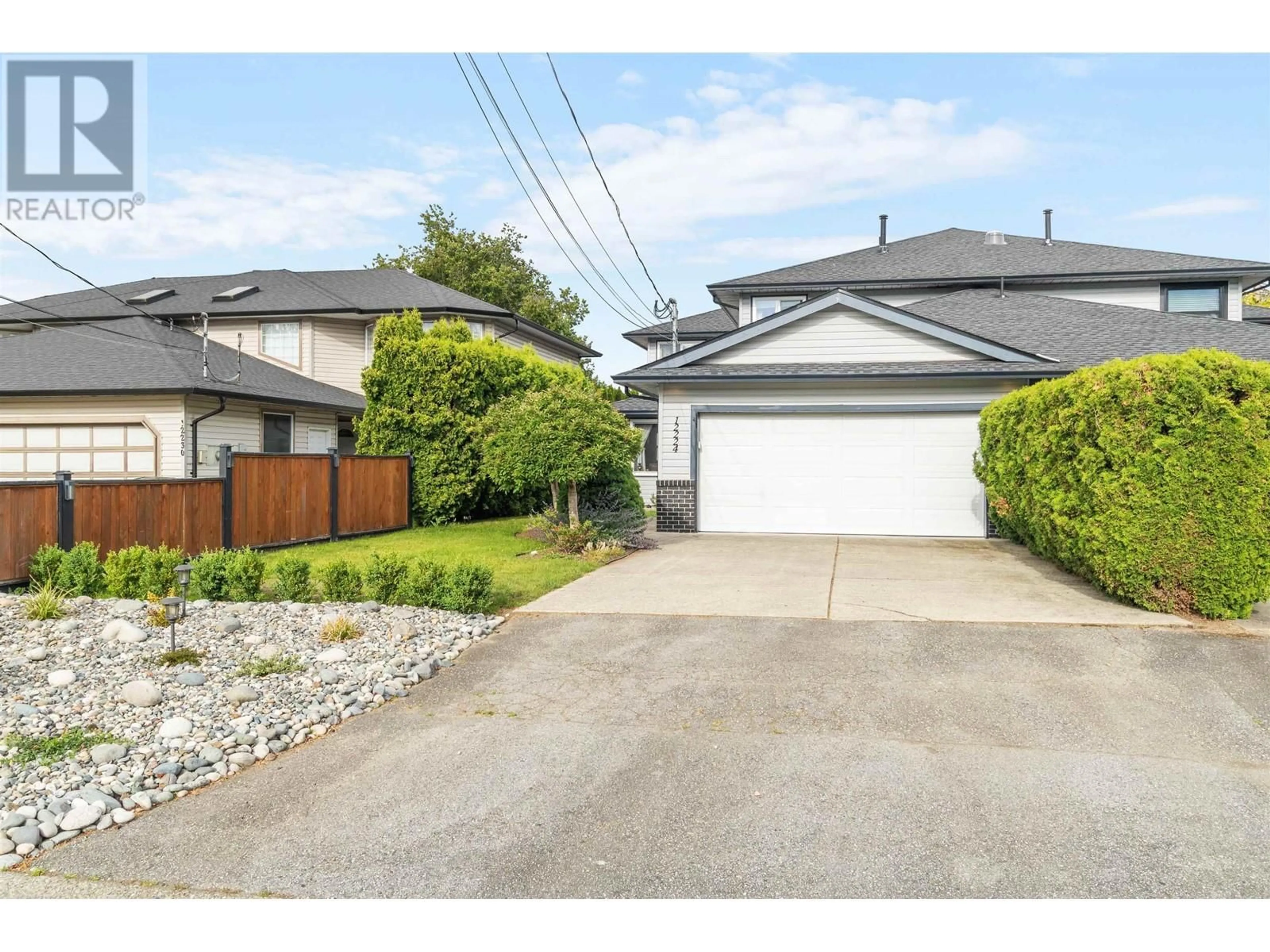 Frontside or backside of a home for 12224 MCMYN AVENUE, Pitt Meadows British Columbia V3Y1C8