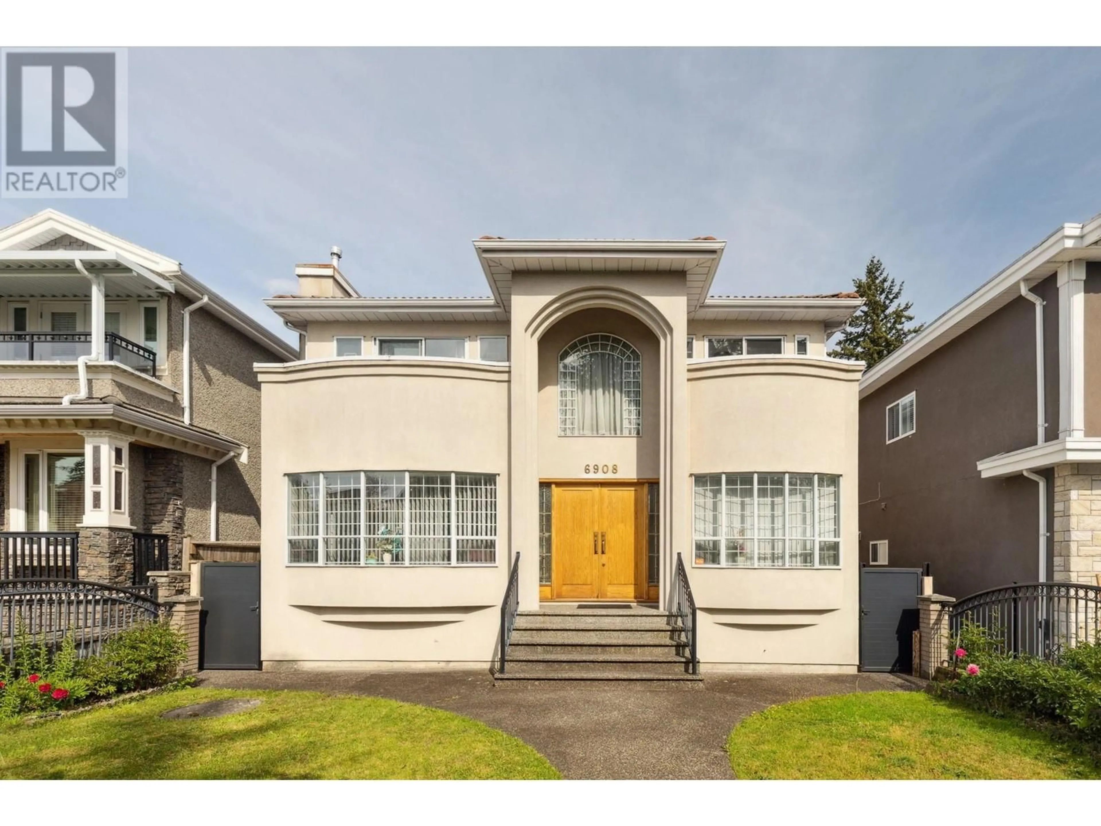 Frontside or backside of a home for 6908 DAWSON STREET, Vancouver British Columbia V5S2W3