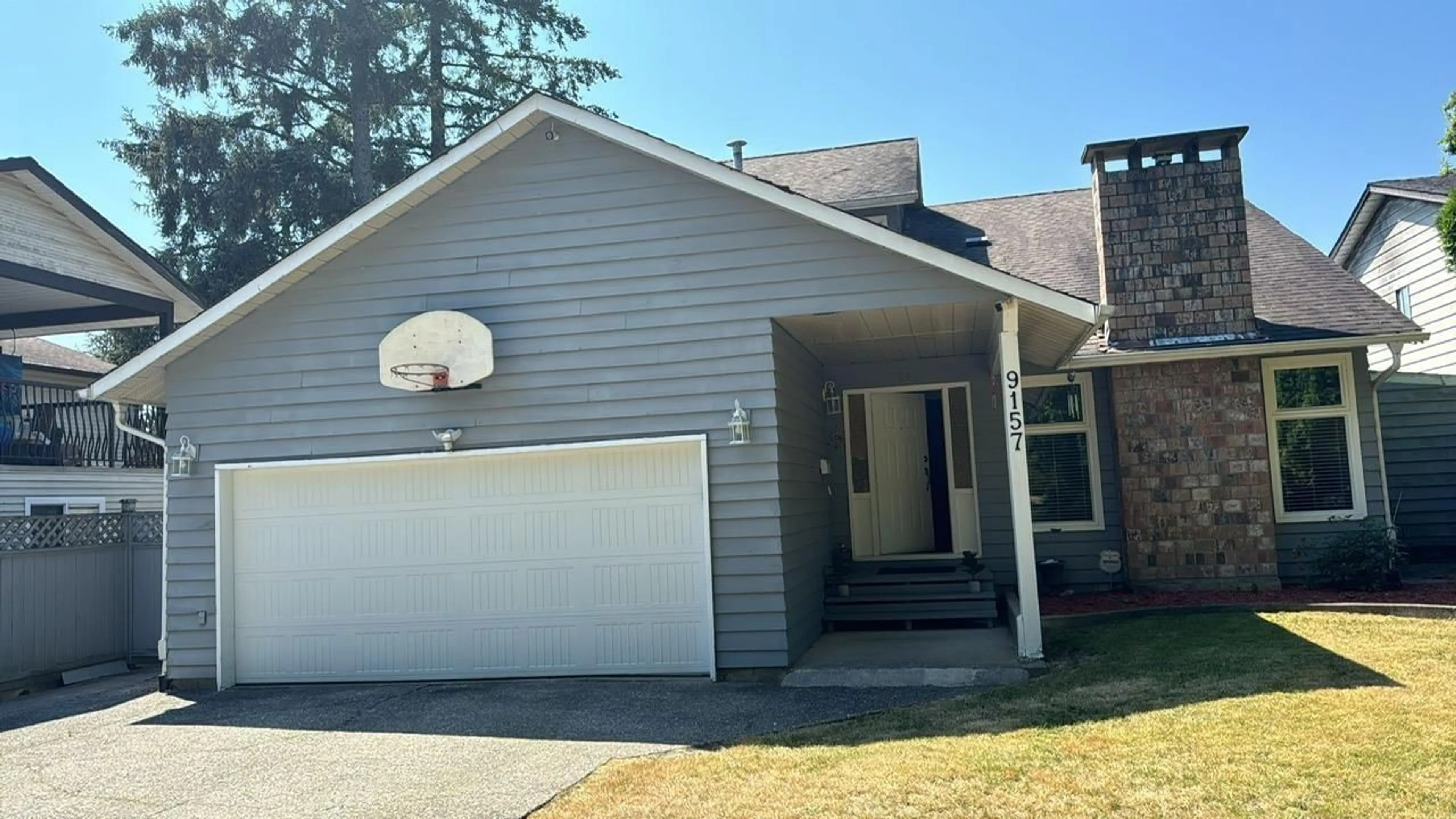 Frontside or backside of a home for 9157 144A STREET, Surrey British Columbia V3R7L4