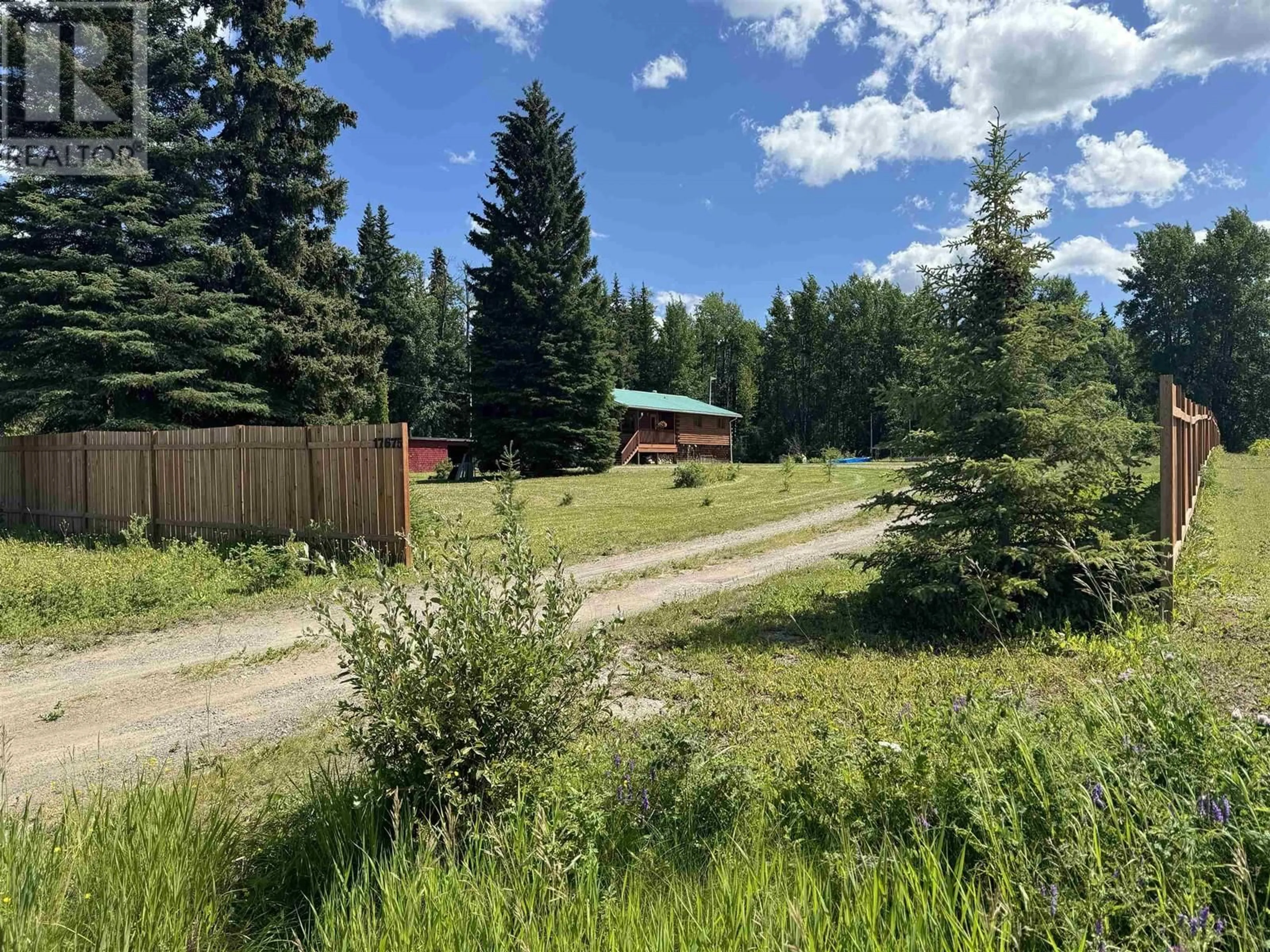 A pic from exterior of the house or condo, the fenced backyard for 17675 TURNER FRONTAGE ROAD, Vanderhoof British Columbia V0J3A2